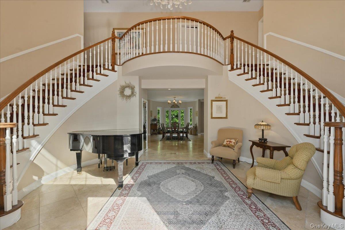 31 Cornwall Lane Sands Point, NY 11050 - Photo 6 of 49 a view of entryway livingroom and hall with wooden floor