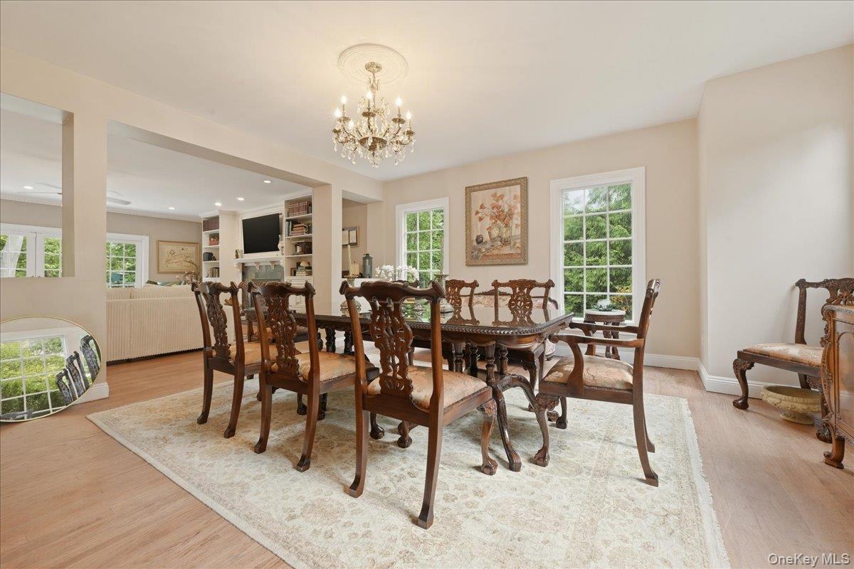 31 Cornwall Lane Sands Point, NY 11050 - Photo 9 of 49 a view of a dining room with furniture window and wooden floor