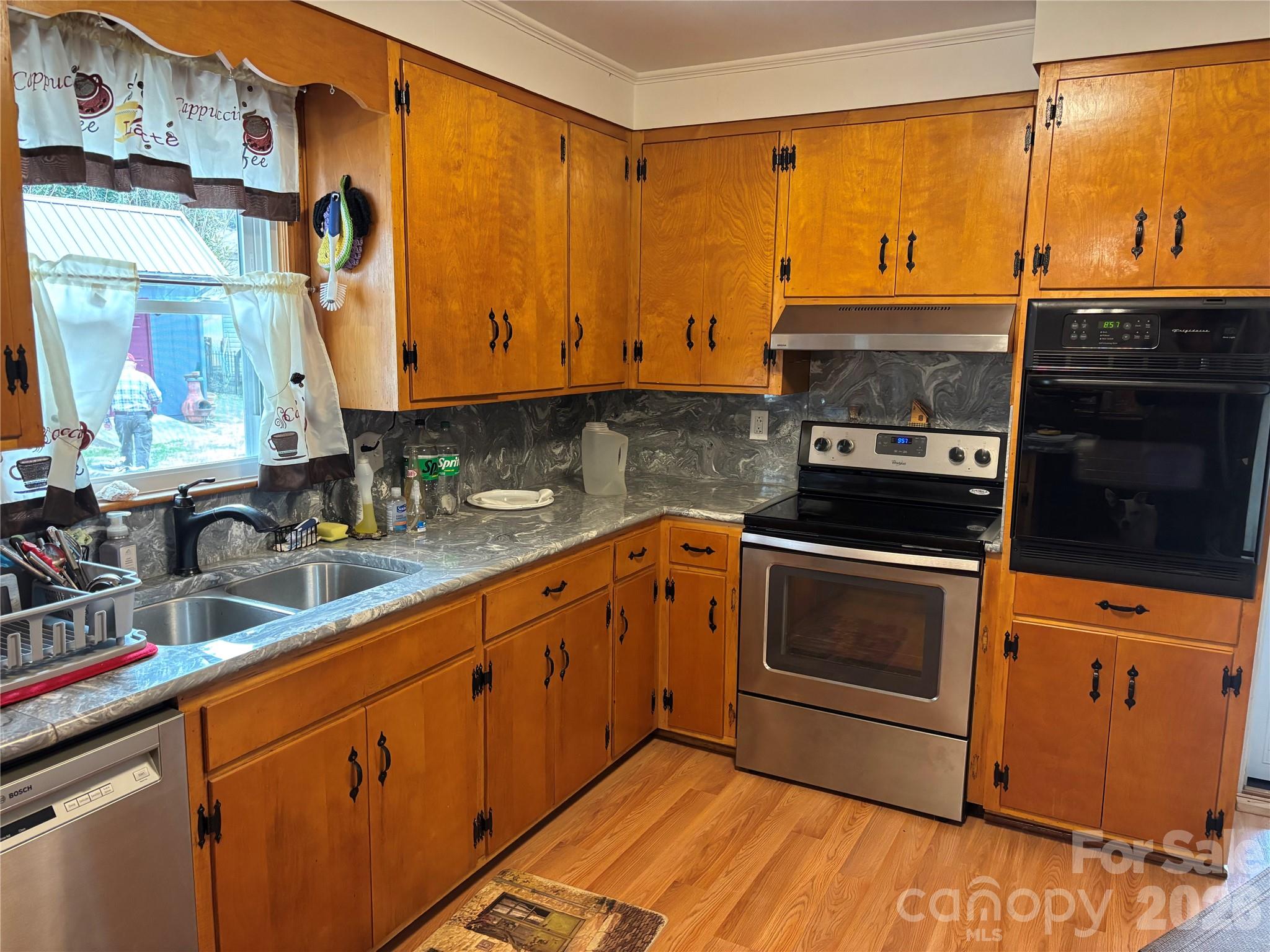 503 9th Avenue Southwest Conover, NC 28613 - Photo 15 of 39 a kitchen with stainless steel appliances a stove a sink and a microwave
