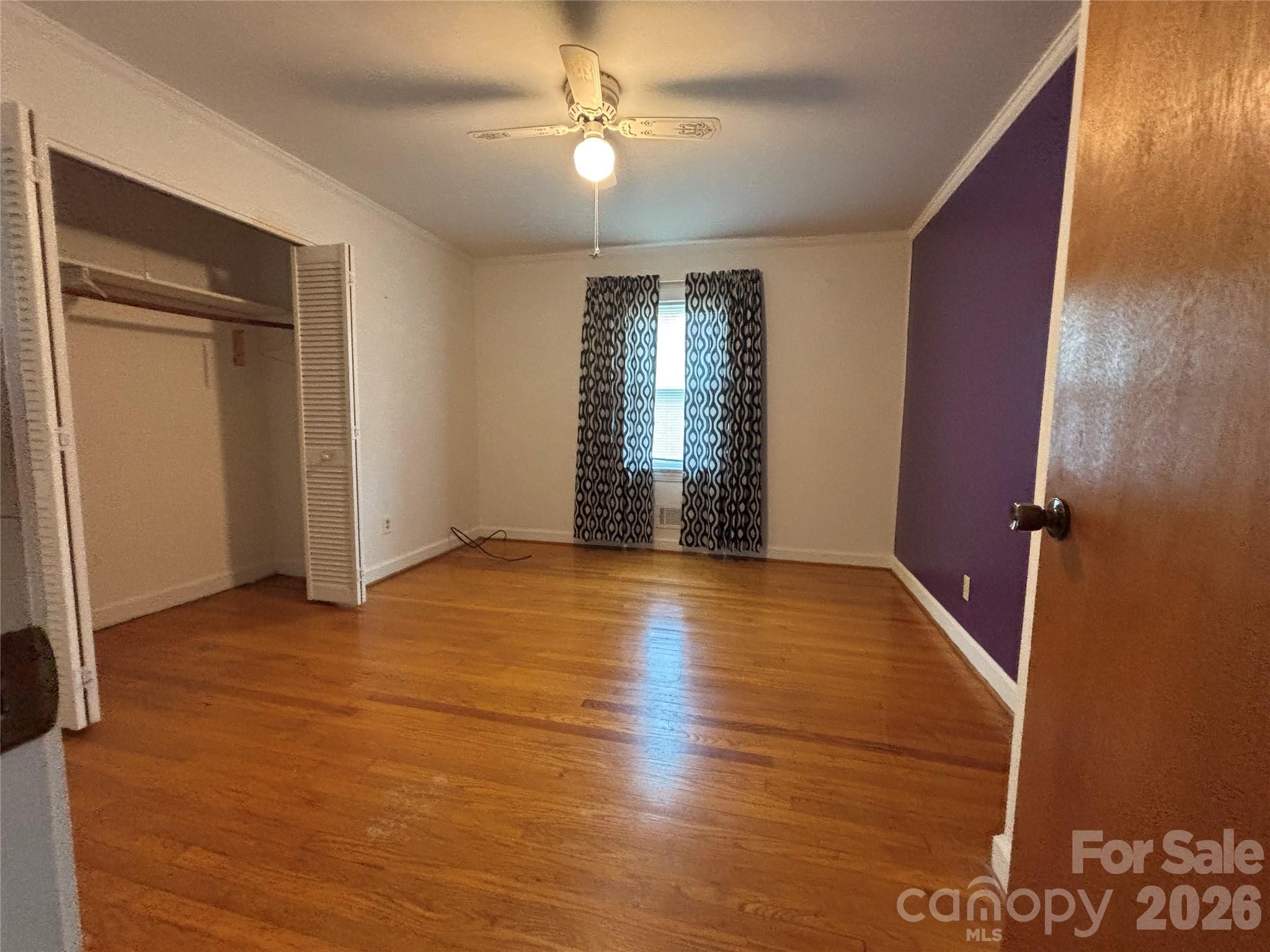 503 9th Avenue Southwest Conover, NC 28613 - Photo 25 of 39 wooden floor in an empty room with a window