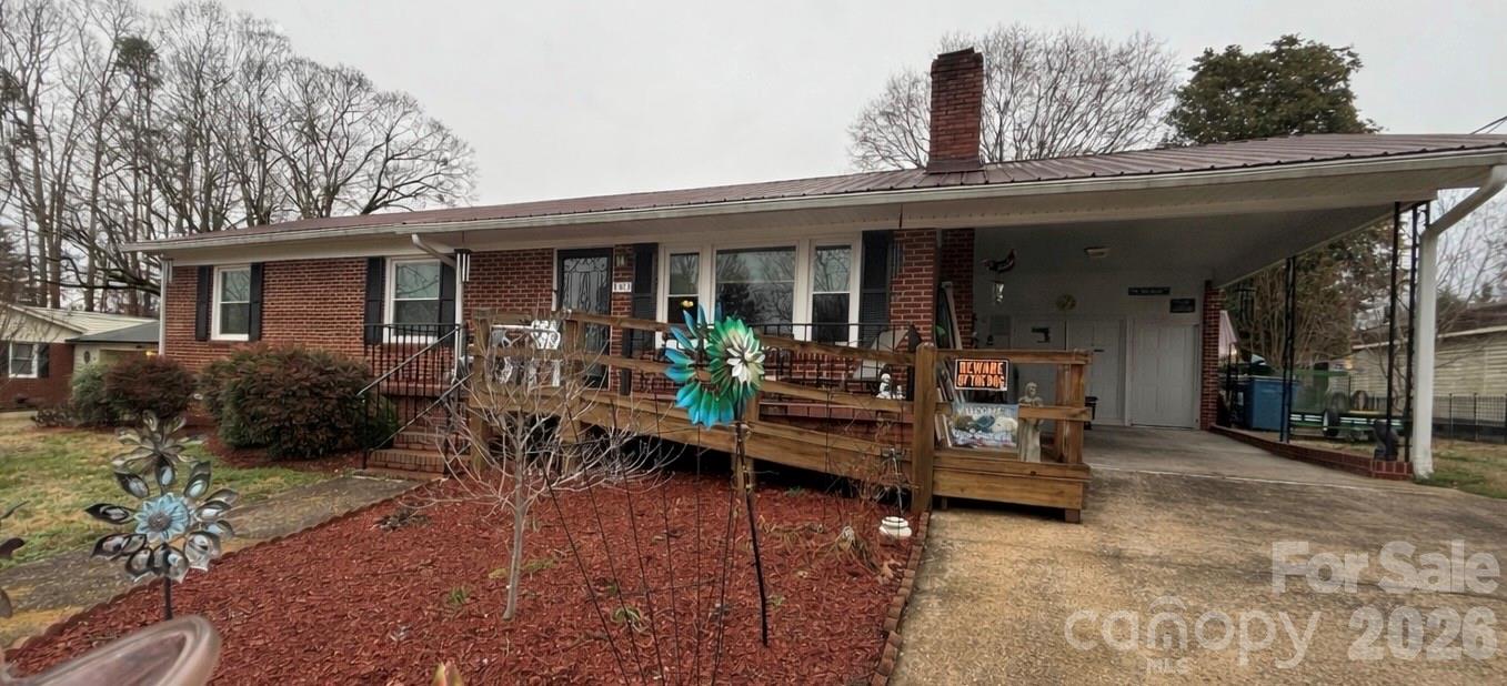 503 9th Avenue Southwest Conover, NC 28613 - Photo 3 of 39 a view of a house with backyard outdoor seating and a patio
