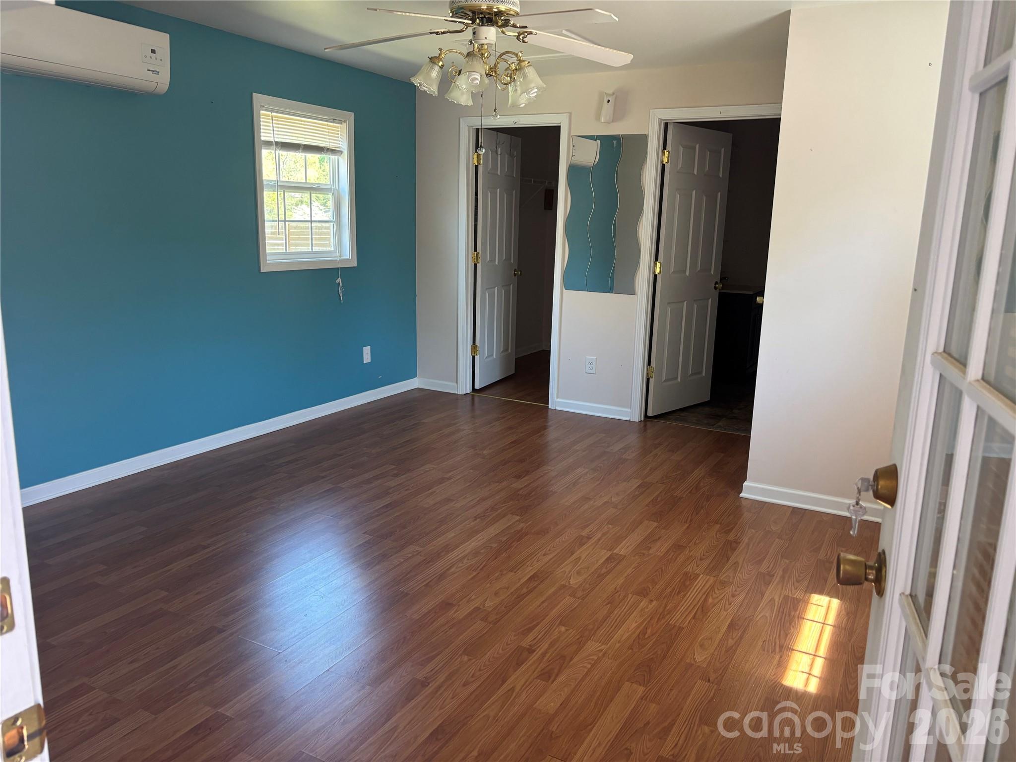 503 9th Avenue Southwest Conover, NC 28613 - Photo 32 of 39 an empty room with wooden floor and a window