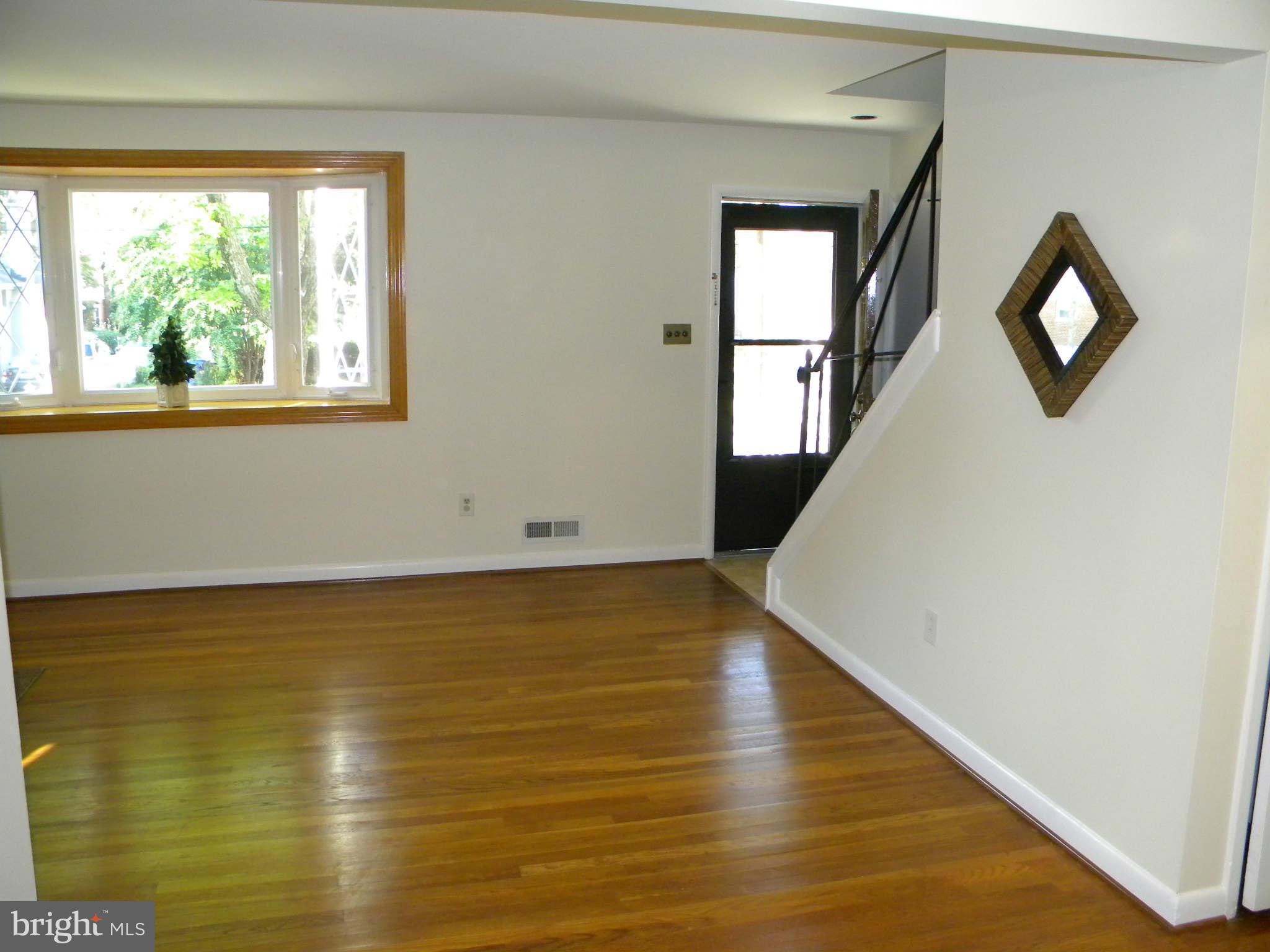 3802 Kayson Street Silver Spring, MD 20906 - Photo 3 of 23 a view of a room with wooden floor and window