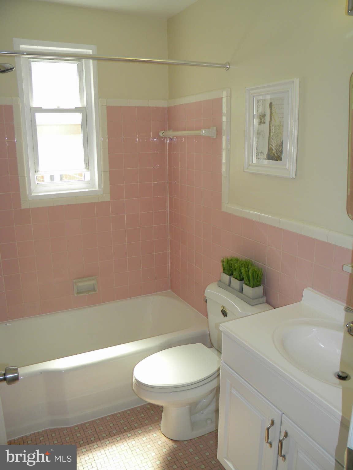 3802 Kayson Street Silver Spring, MD 20906 - Photo 22 of 23 a bathroom with a sink a toilet and tub