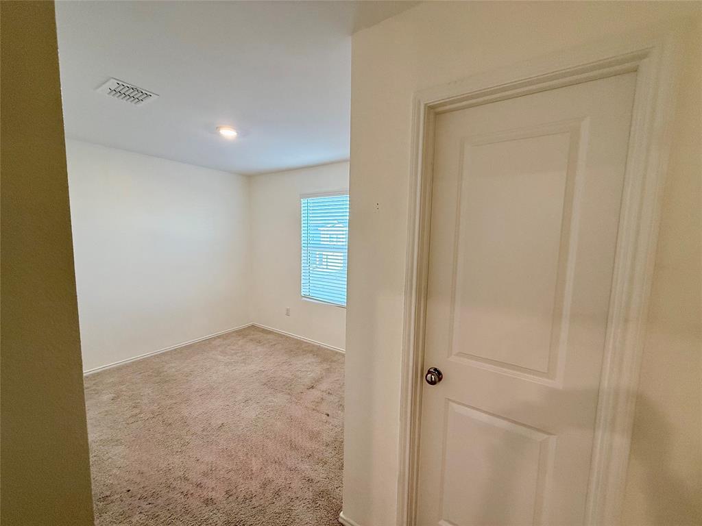 201 Boxberry Way Princeton, TX 75407 - Photo 19 of 24 This well-sized room includes a closet and offers flexibility for a bedroom, office, or guest space.