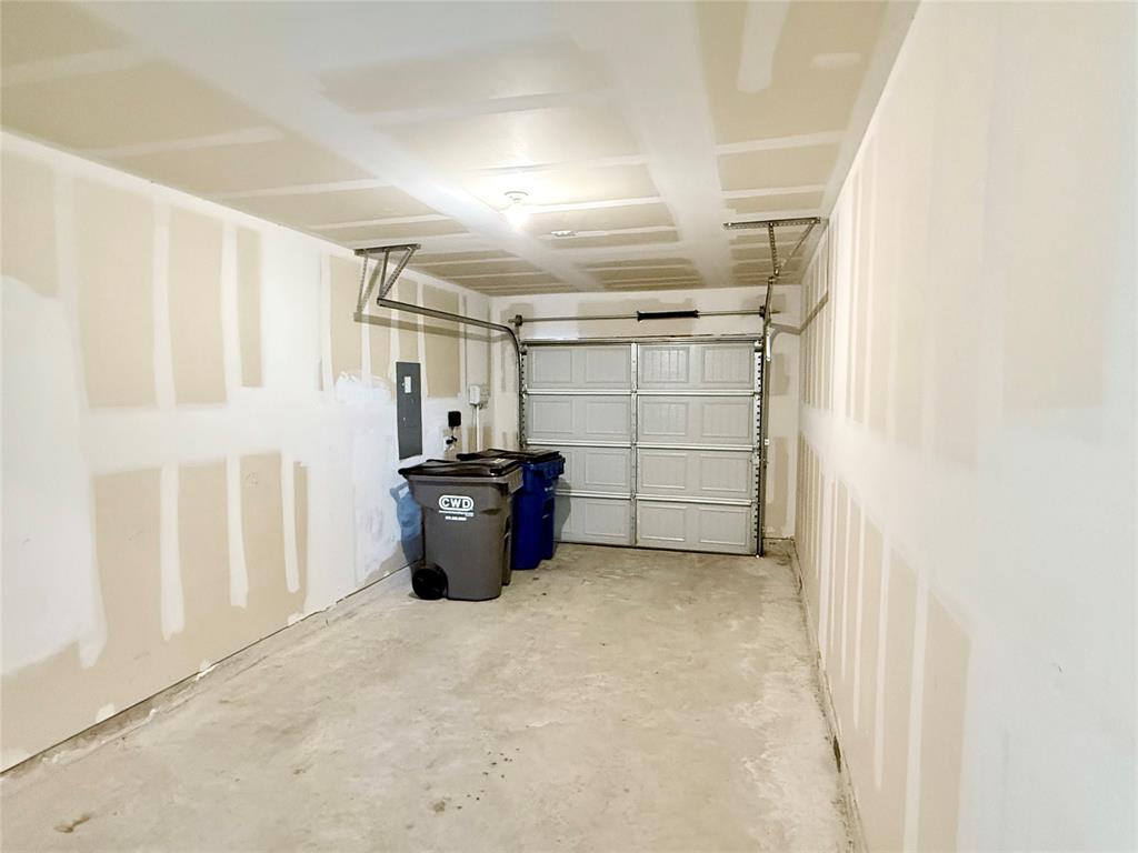 201 Boxberry Way Princeton, TX 75407 - Photo 20 of 24 Attached single-car garage offering secure parking and additional storage space, with easy access to the home—ideal for everyday convenience.