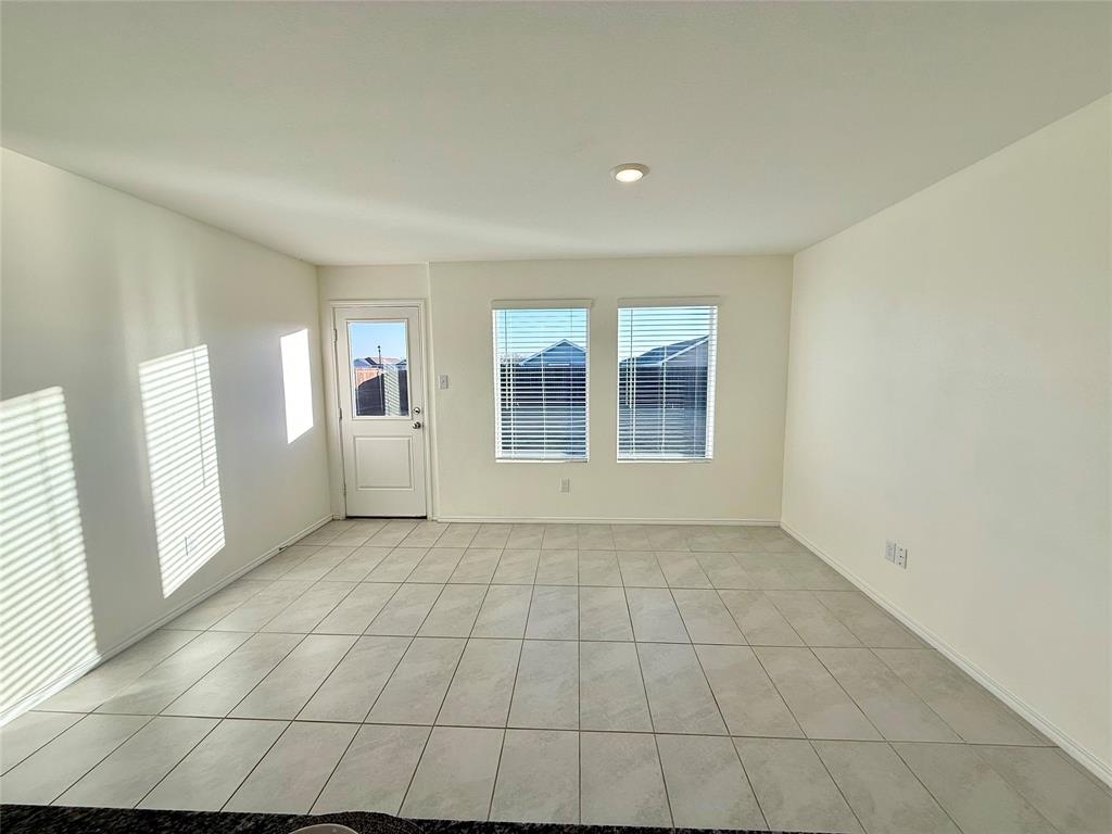 201 Boxberry Way Princeton, TX 75407 - Photo 7 of 24 a view of an empty room with a window
