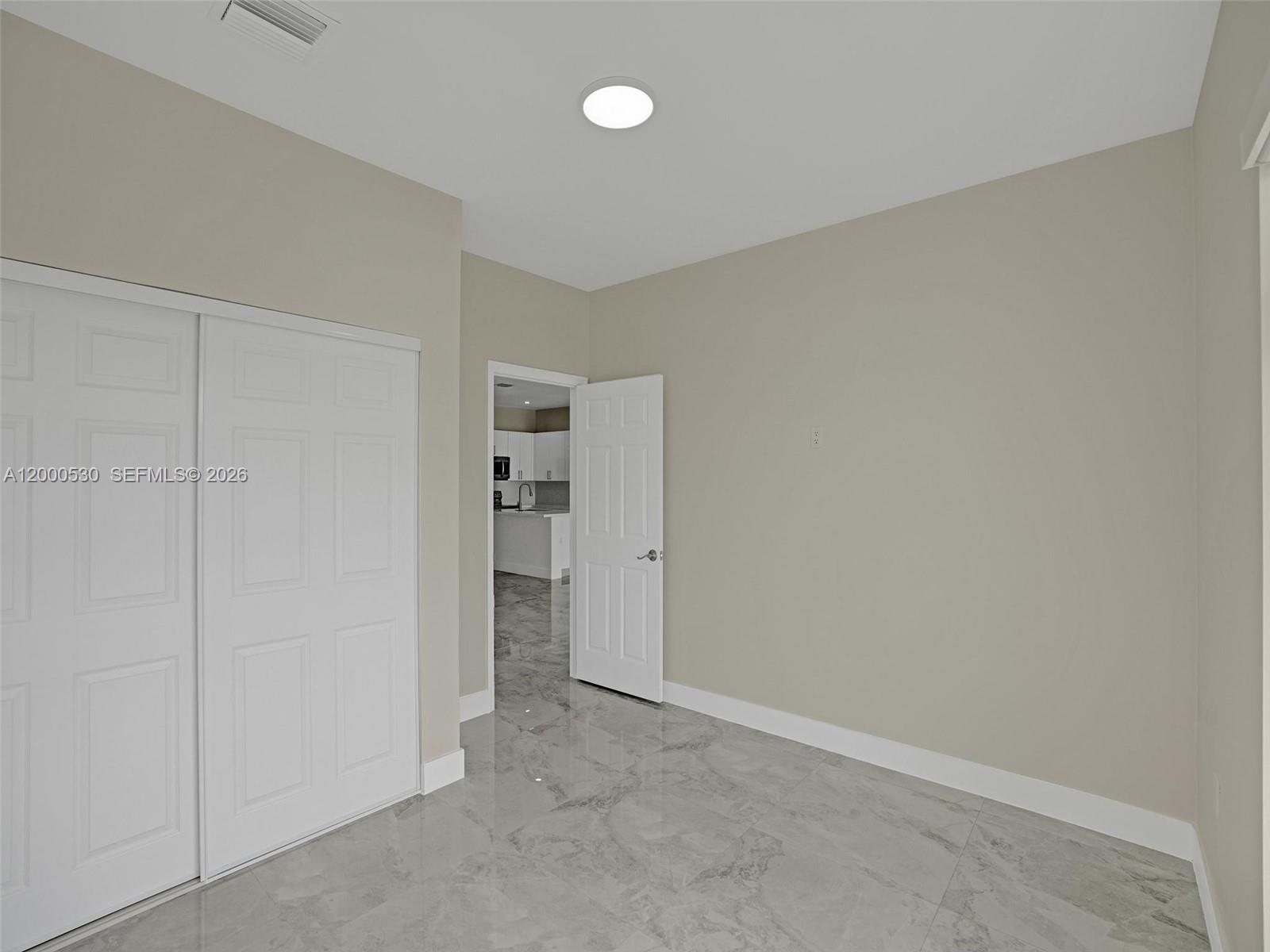 14519 Southwest 272nd Street, Unit 14519 Homestead, FL 33032 - Photo 13 of 32 a view of an empty room