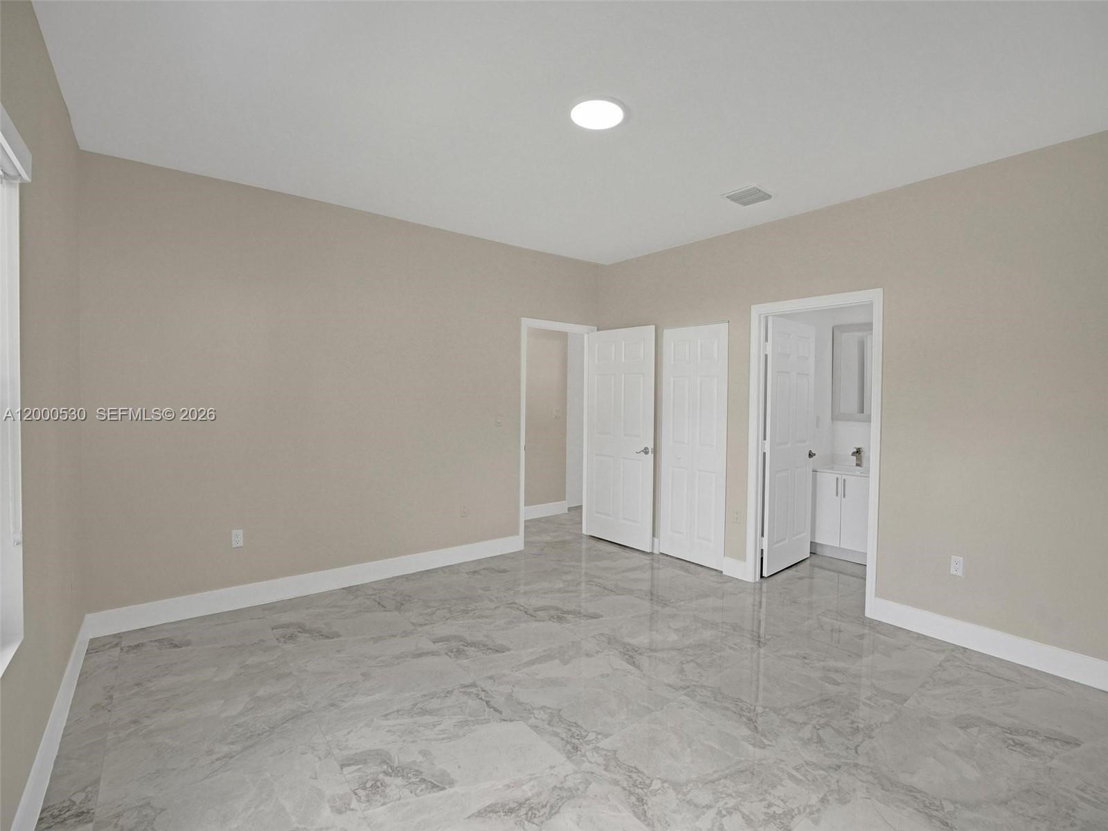 14519 Southwest 272nd Street, Unit 14519 Homestead, FL 33032 - Photo 23 of 32 a view of an empty room