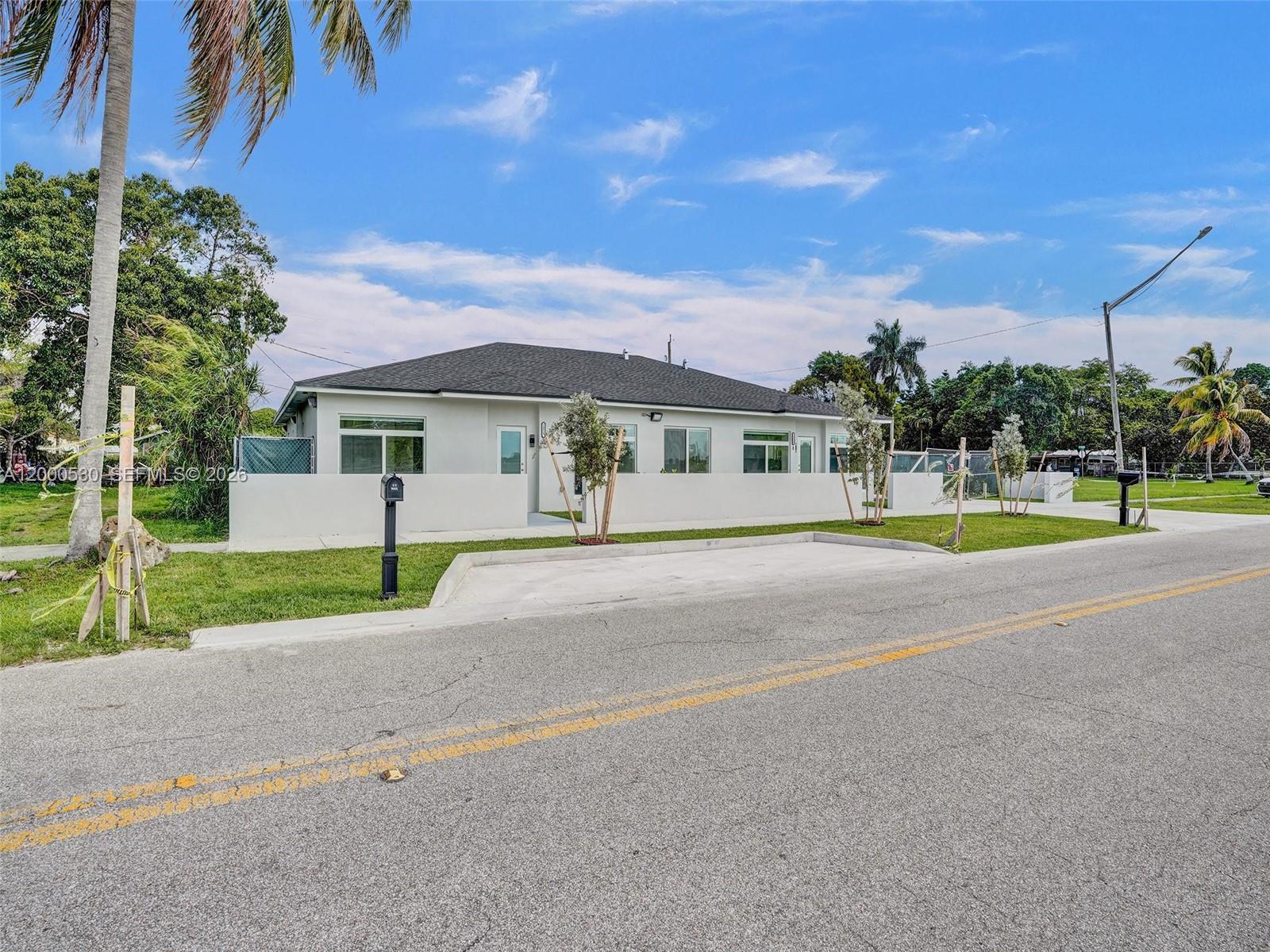 14519 Southwest 272nd Street, Unit 14519 Homestead, FL 33032 - Photo 31 of 32 a view of the house with a swimming pool