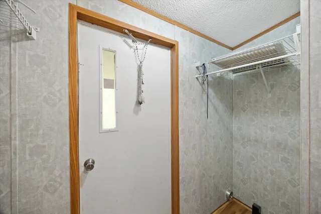 a bathroom with a glass shower door