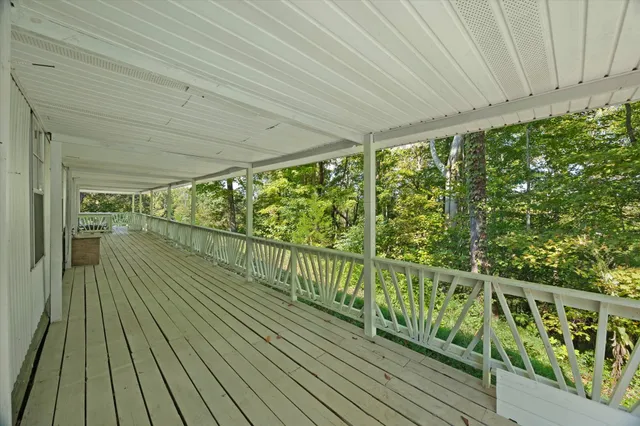 a view of balcony with wooden floor