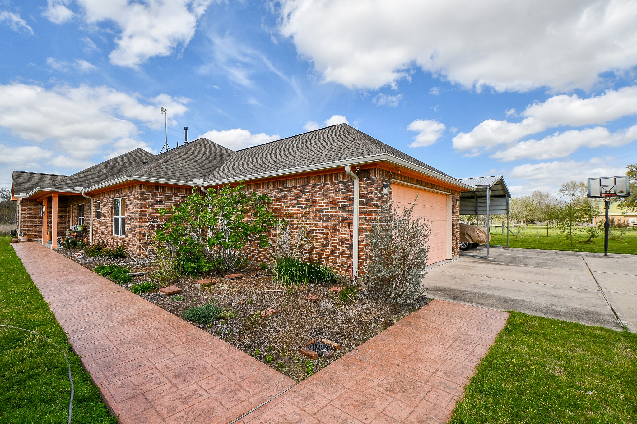 8227 Katy Hockley Road Katy, TX 77493 - Photo 11 of 20 a front view of a house with garden
