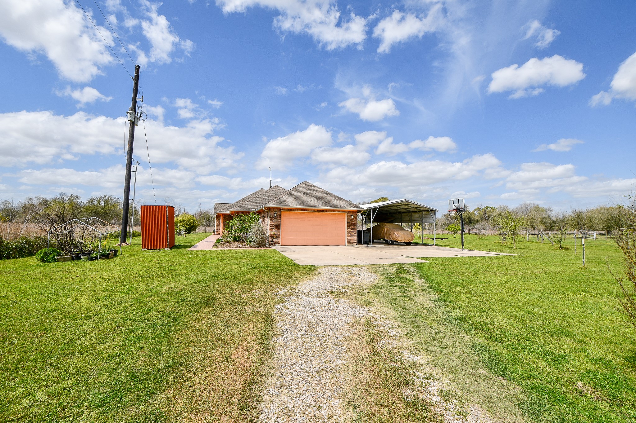 8227 Katy Hockley Road Katy, TX 77493 - Photo 8 of 20 a front view of a house with a yard and table and chairs