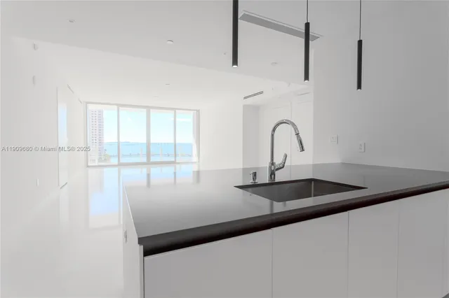 a kitchen with a sink and a window