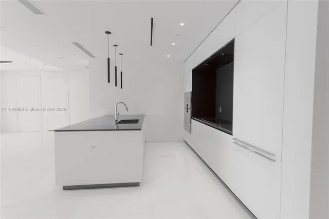 an entryway with an empty room