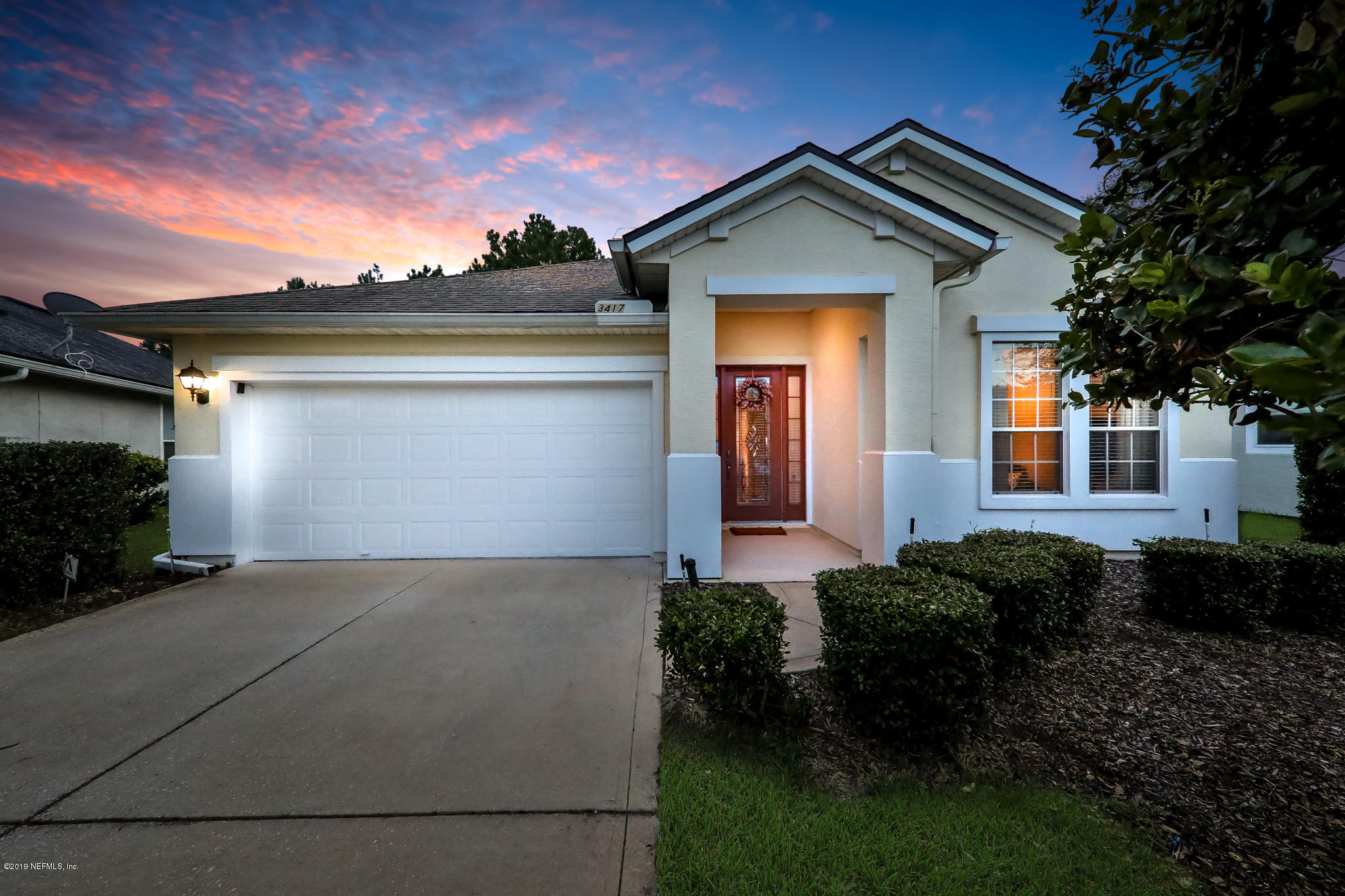 3417 South Saxxon Road St. Augustine, FL 32092 - Photo 1 of 47 a front view of a house with garden