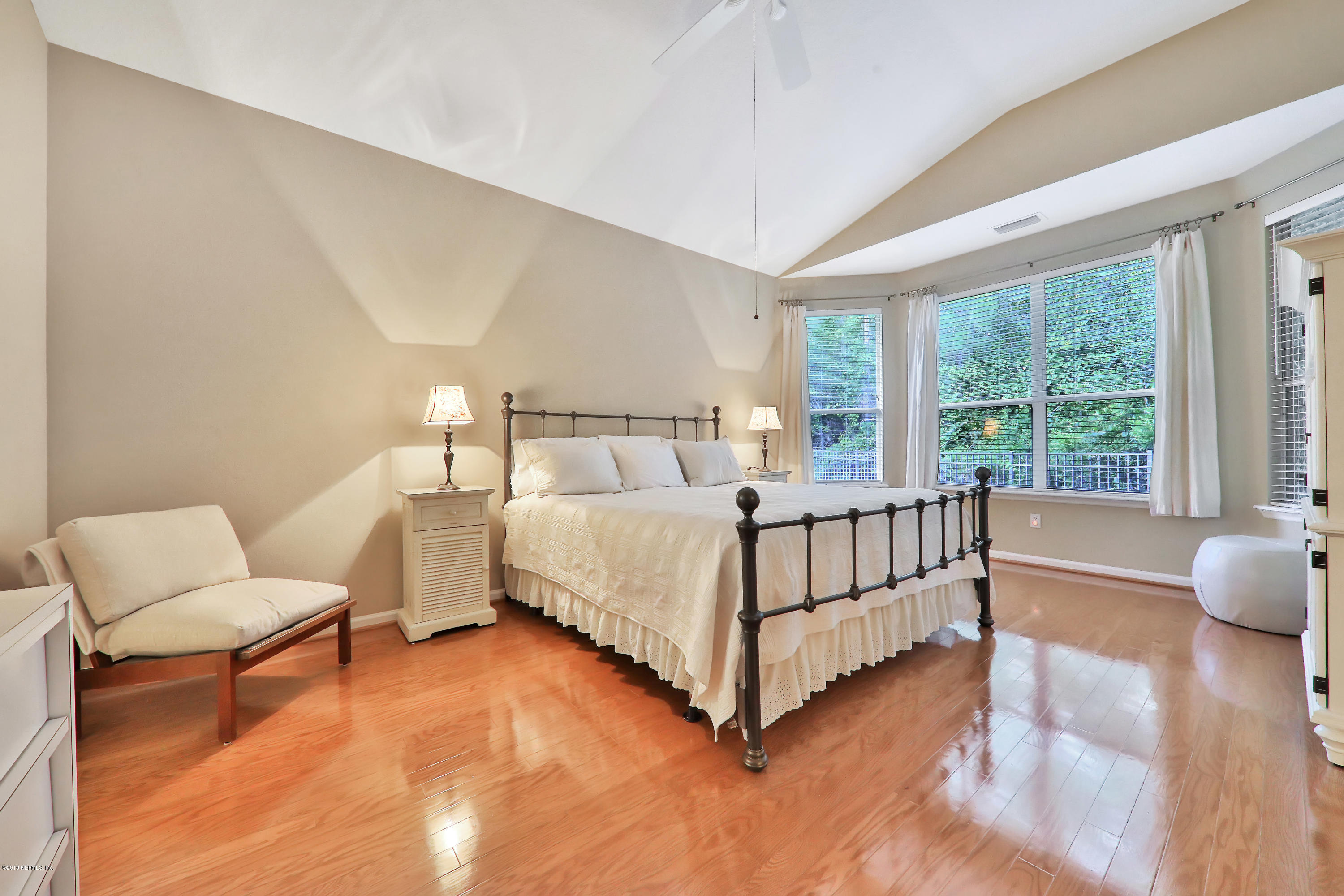 3417 South Saxxon Road St. Augustine, FL 32092 - Photo 16 of 47 a bedroom with a bed and a large window