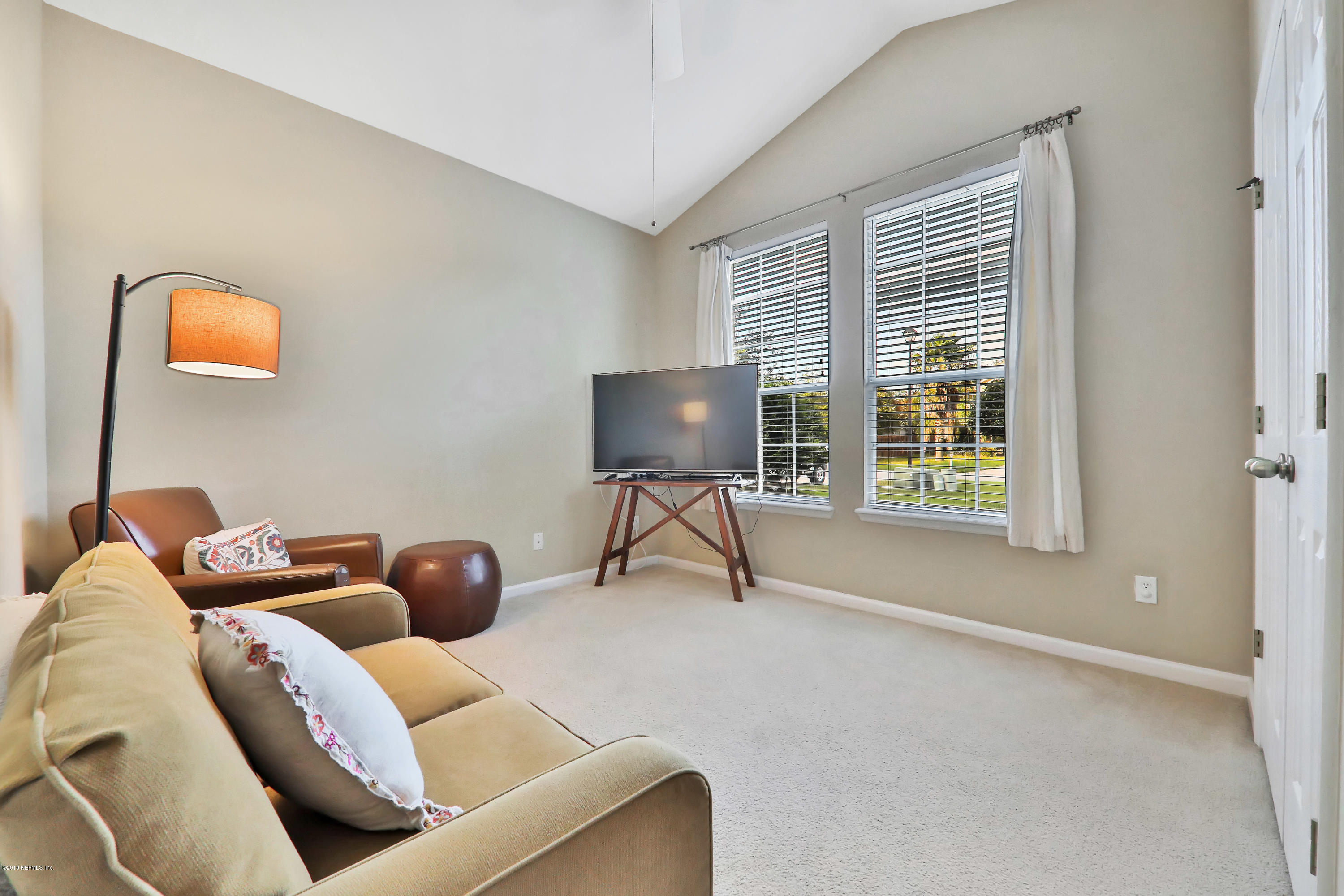 3417 South Saxxon Road St. Augustine, FL 32092 - Photo 23 of 47 a living room with furniture and a window
