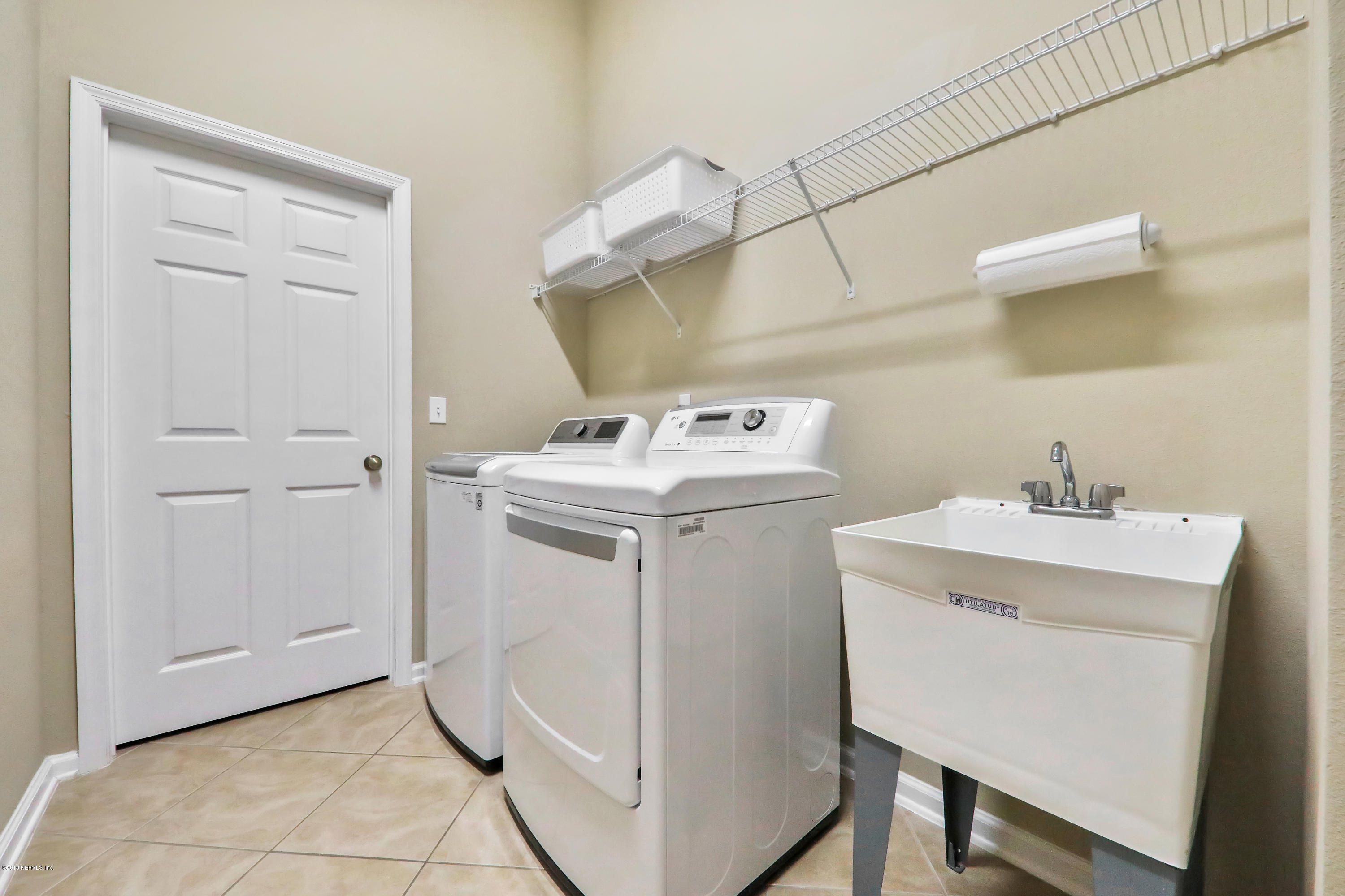 3417 South Saxxon Road St. Augustine, FL 32092 - Photo 24 of 47 a utility room with dryer and washer