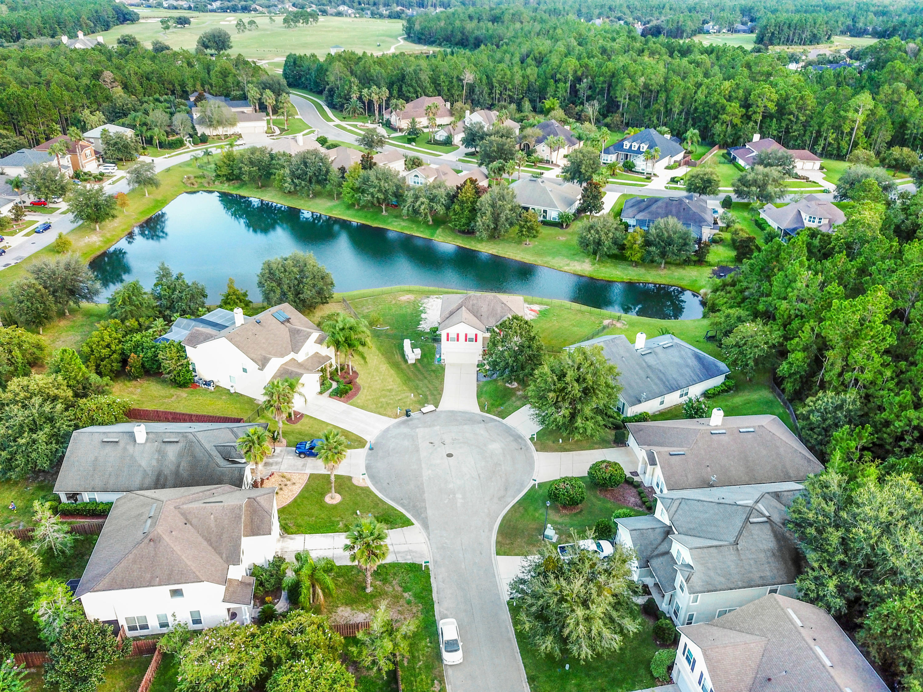 3417 South Saxxon Road St. Augustine, FL 32092 - Photo 3 of 47 an aerial view of a house with garden space and lake view