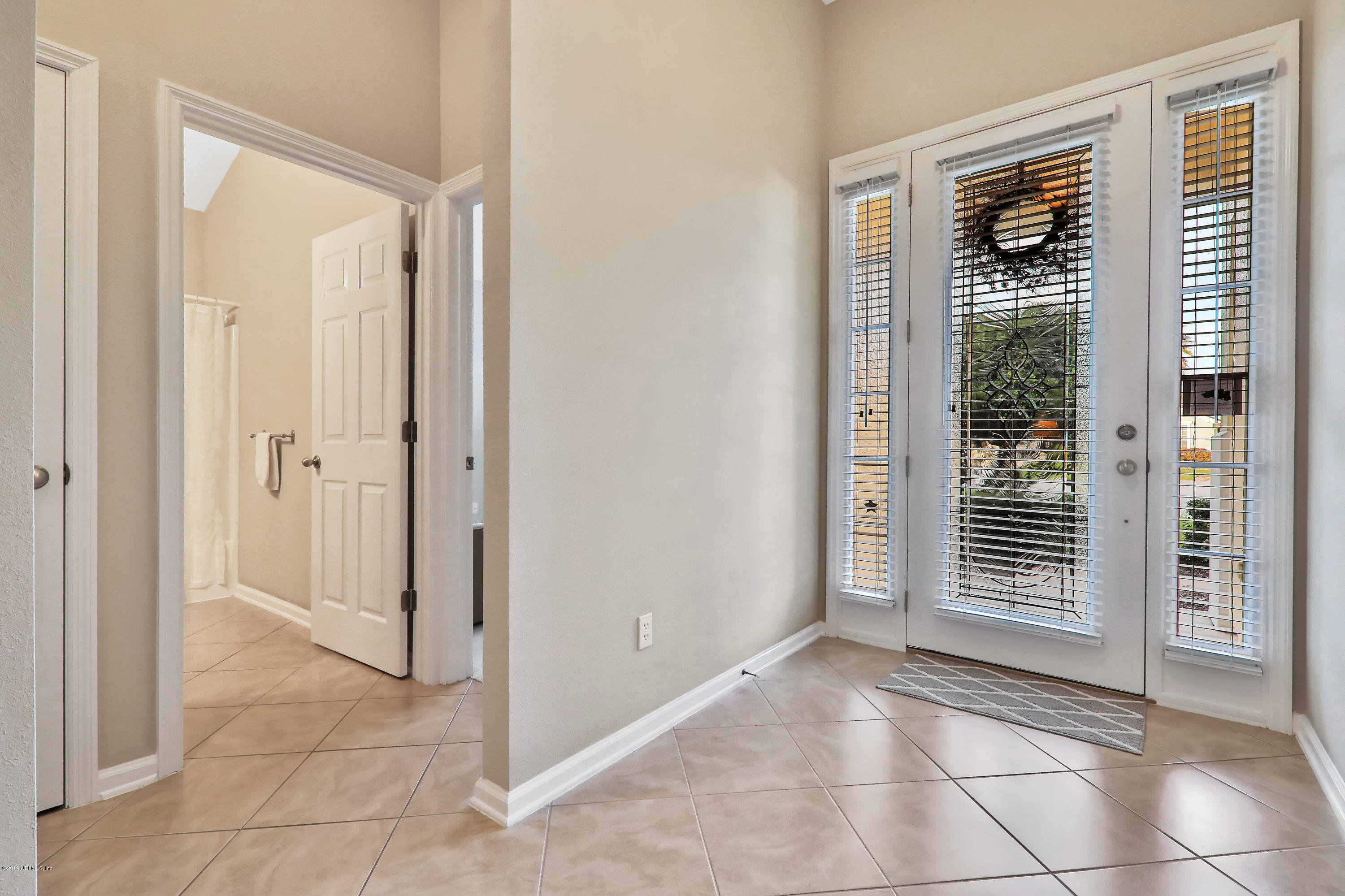 3417 South Saxxon Road St. Augustine, FL 32092 - Photo 4 of 47 a view of hallway with windows
