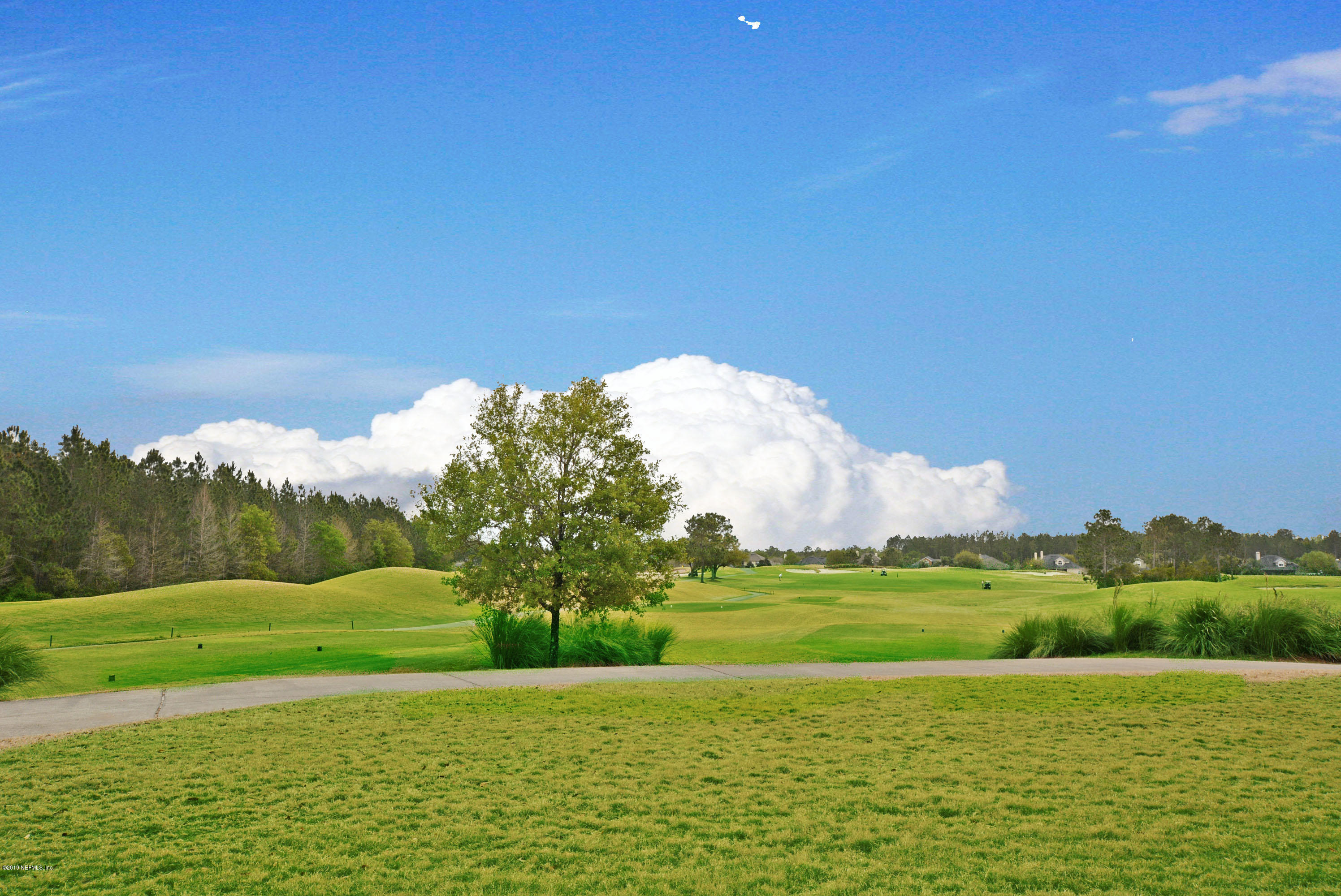 3417 South Saxxon Road St. Augustine, FL 32092 - Photo 46 of 47 a view of a golf course with a lake