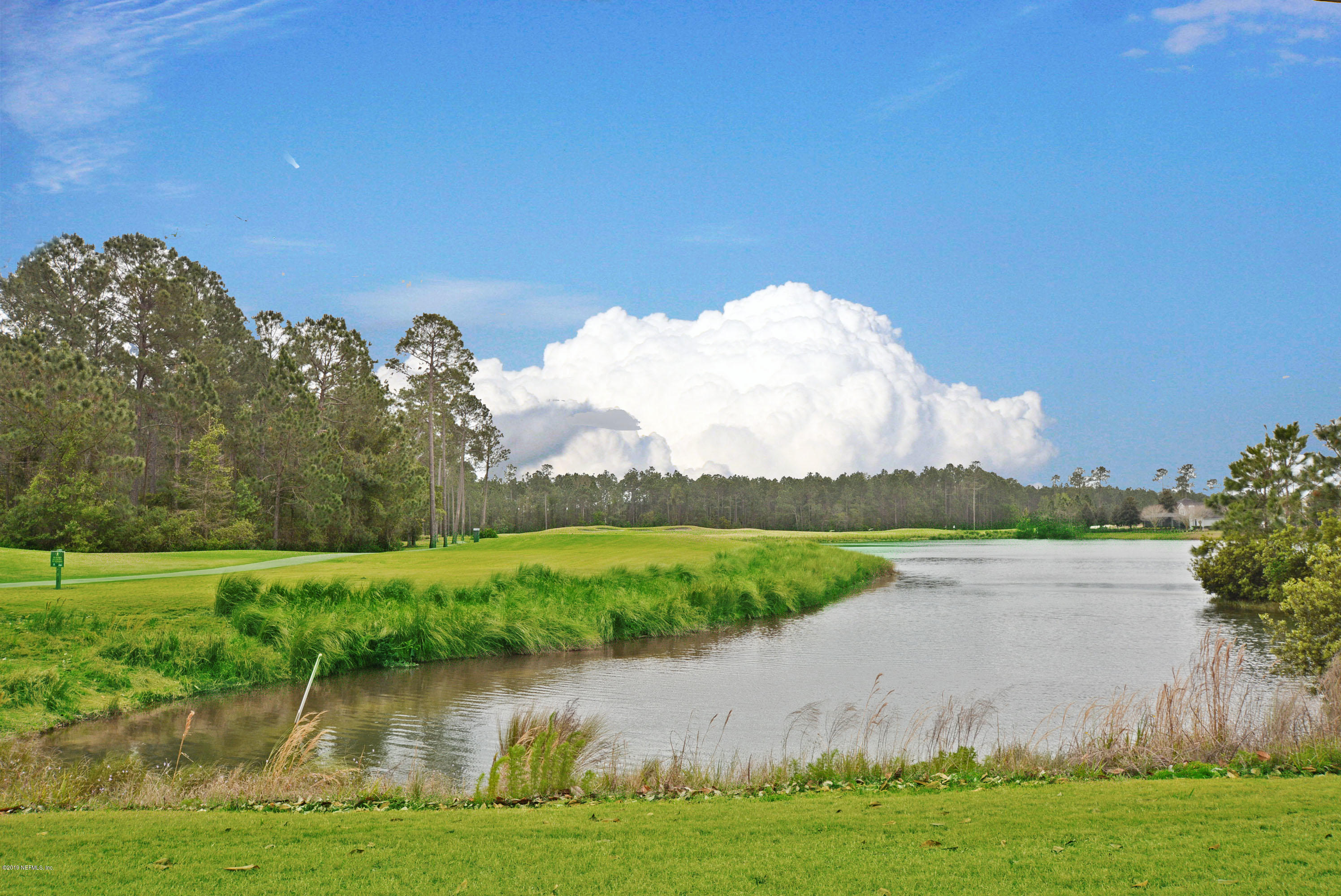 3417 South Saxxon Road St. Augustine, FL 32092 - Photo 47 of 47 a view of a lake with a big yard