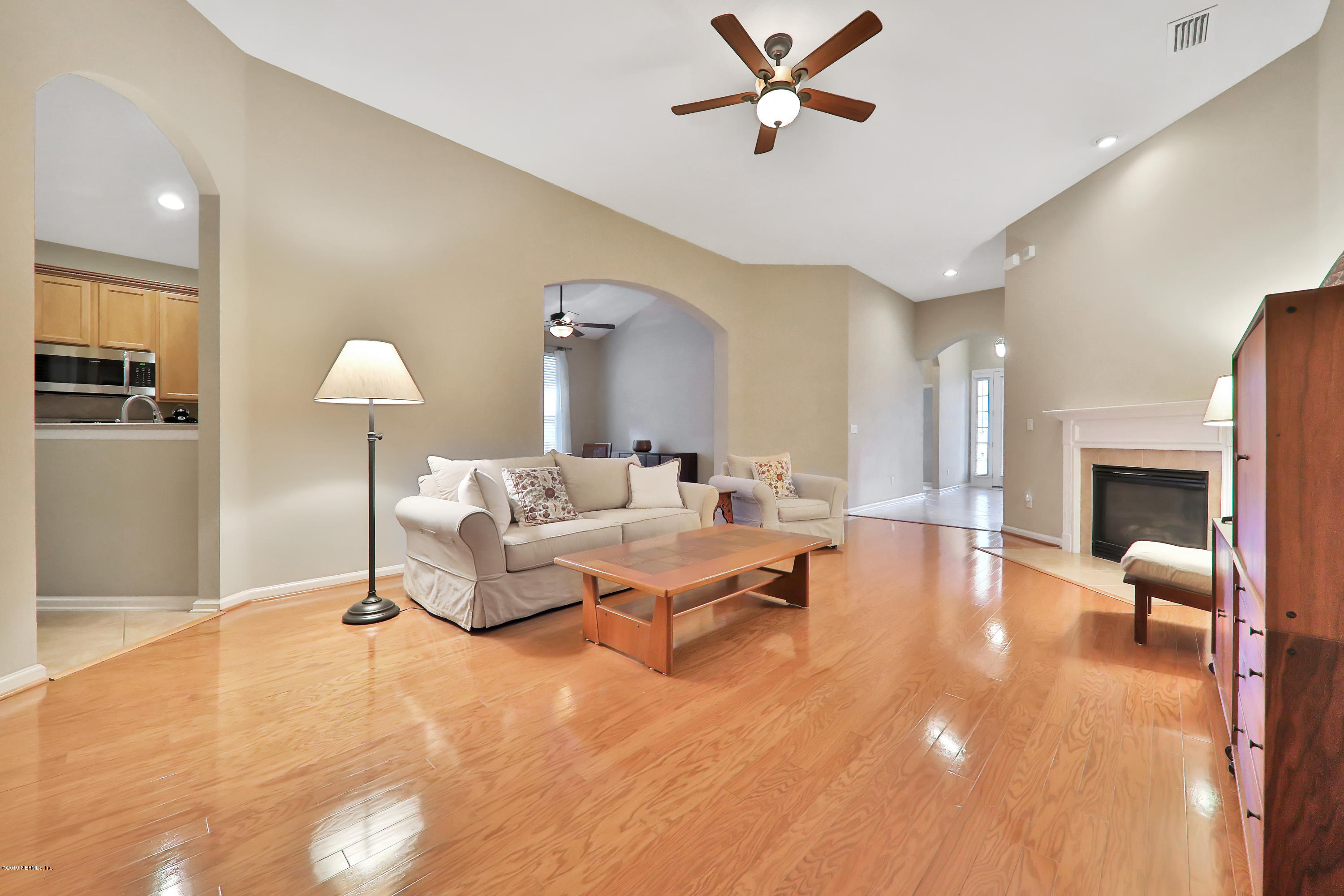 3417 South Saxxon Road St. Augustine, FL 32092 - Photo 6 of 47 a living room with furniture and a fireplace