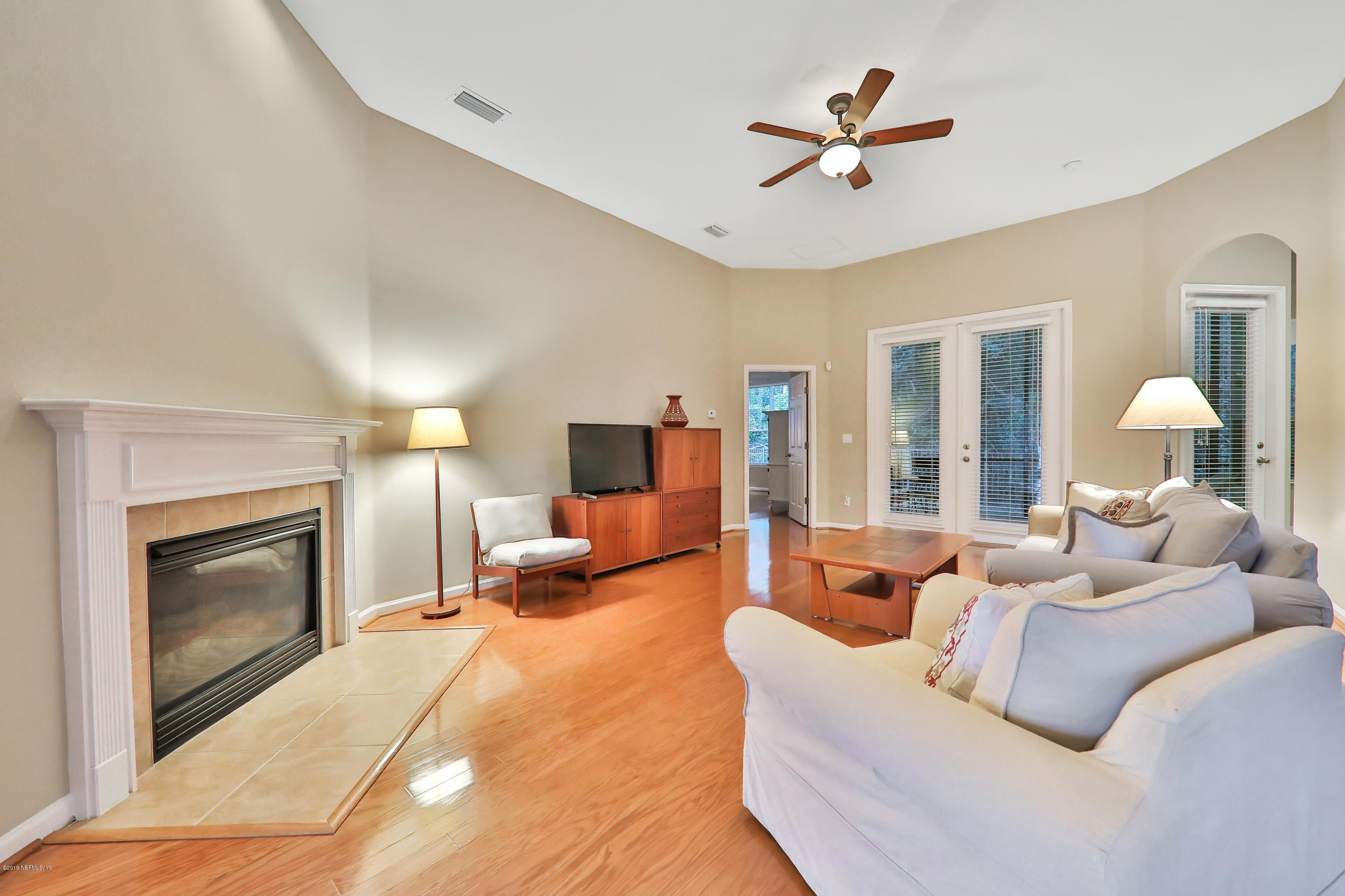 3417 South Saxxon Road St. Augustine, FL 32092 - Photo 7 of 47 a living room with furniture and a fireplace