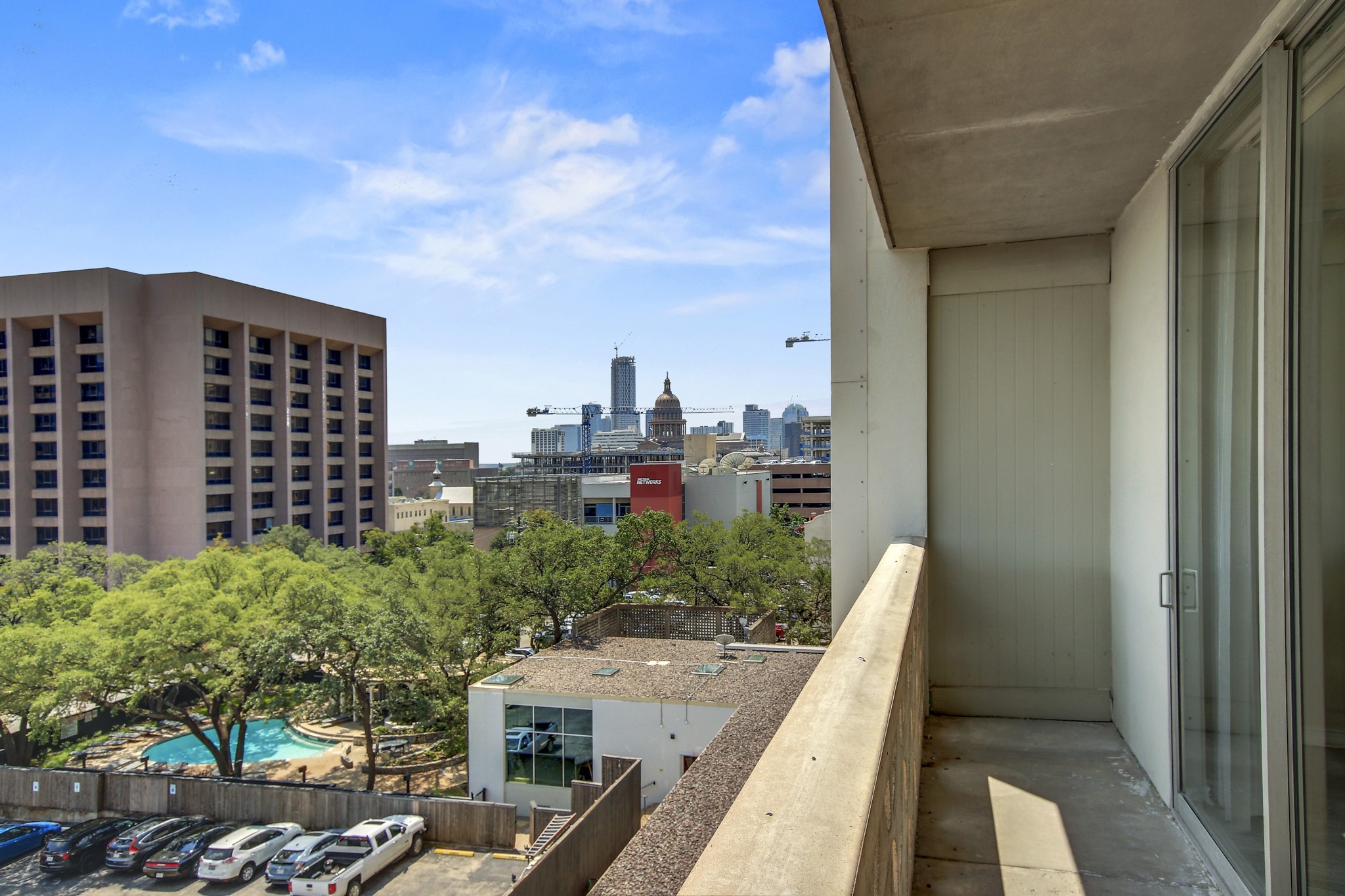 1801 Lavaca Street, Unit 5F Austin, TX 78701 - Photo 23 of 37 Balcony with a skyline view and view of pool area