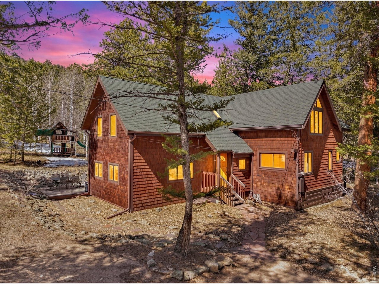 251 Haugen Slide Road Allenspark, CO 80510 - Photo 42 of 42 a front view of a house with a yard