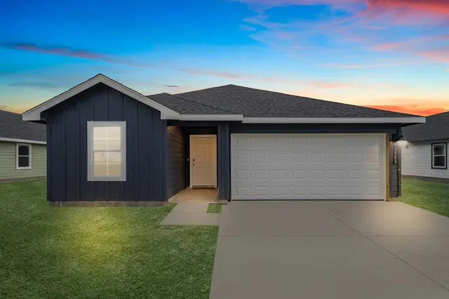 a front view of house with garage