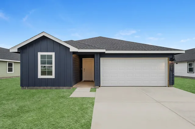 a front view of house with yard