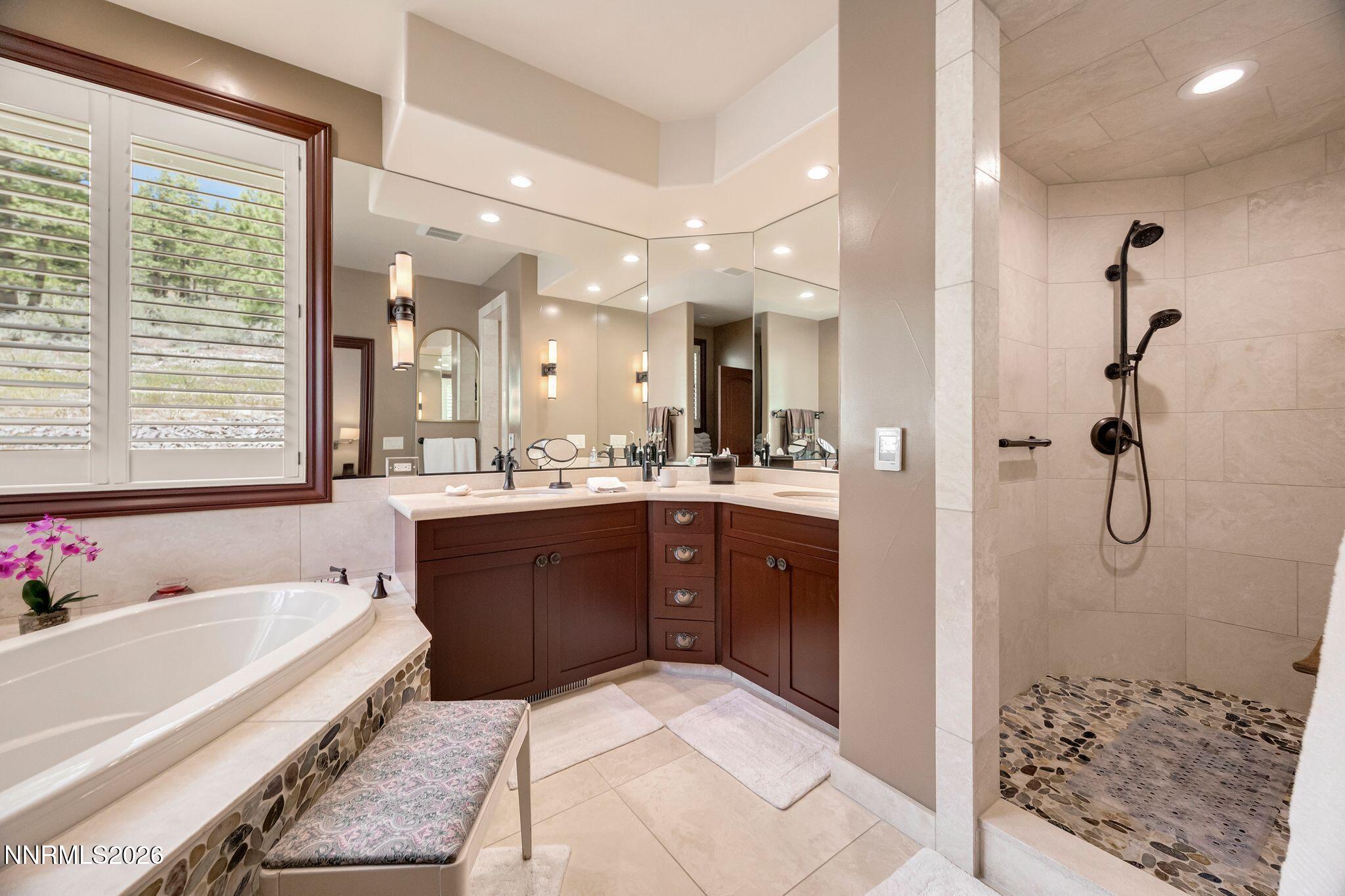 250 Jacks Valley Ranch Road Carson City, NV 89705 - Photo 19 of 44 a spacious bathroom with a tub sink shower and mirror