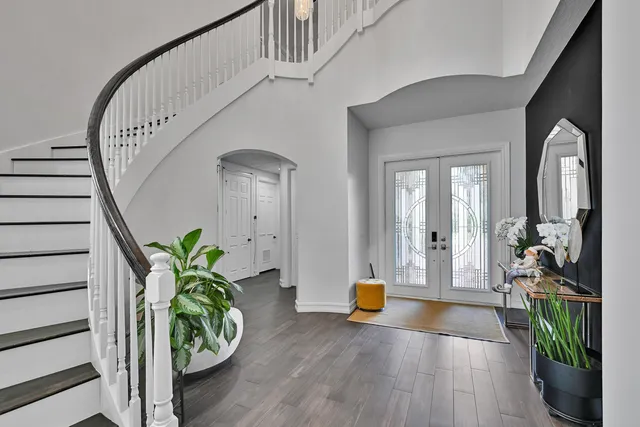 a view of a dining room with furniture and chandelier