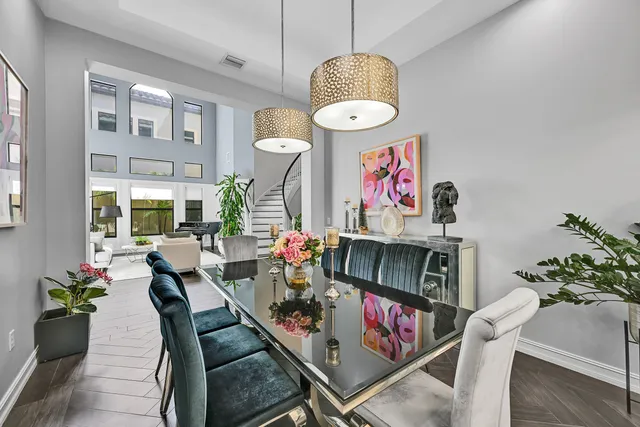 a kitchen with stainless steel appliances granite countertop a stove refrigerator and cabinets