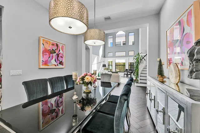 a kitchen with stainless steel appliances granite countertop a sink stove and wooden floor