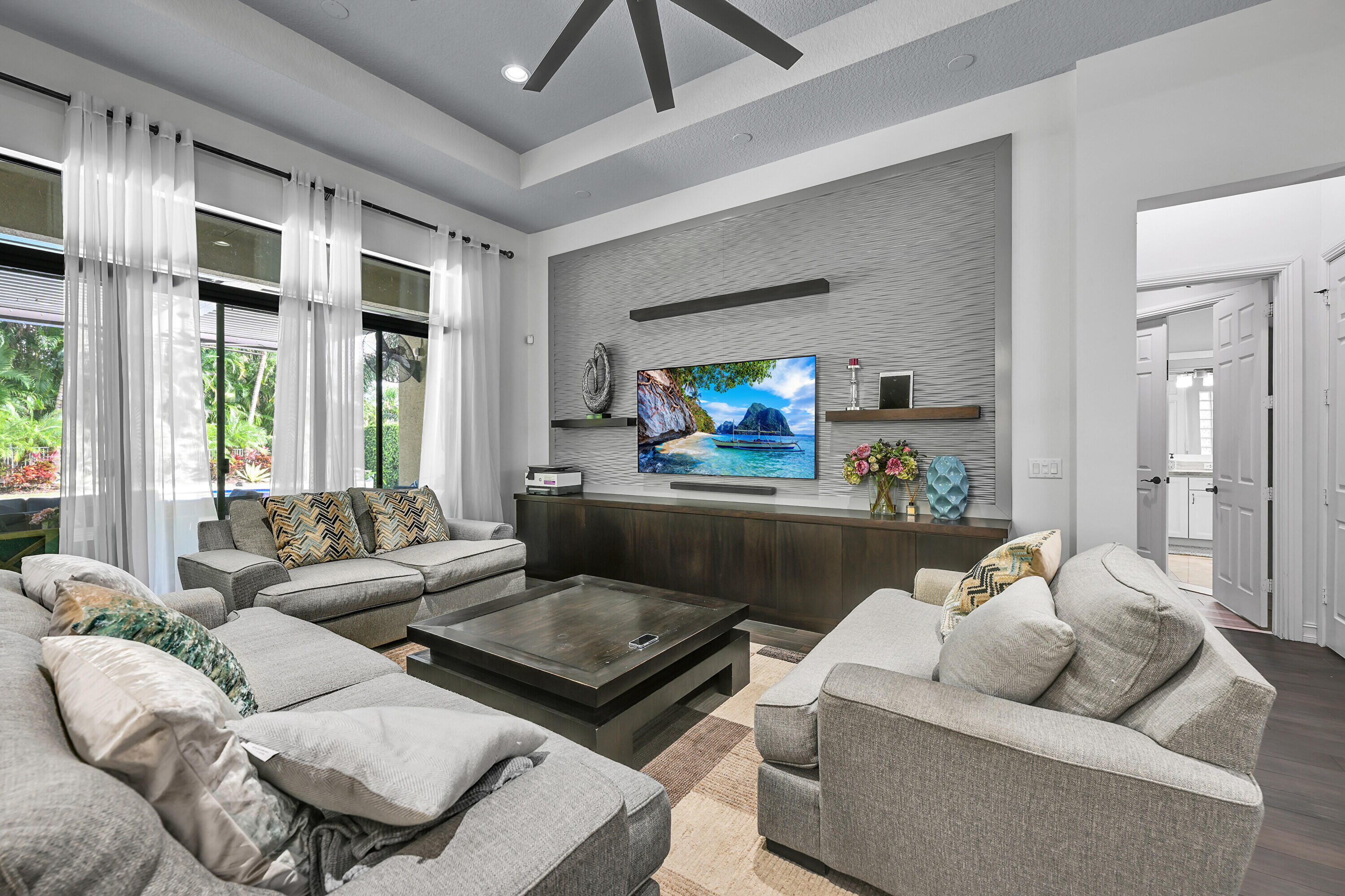 8652 Lewis River Road Delray Beach, FL 33446 - Photo 27 of 85 a living room with furniture and a flat screen tv
