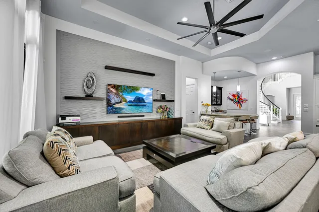 a bedroom with a bed couch and window