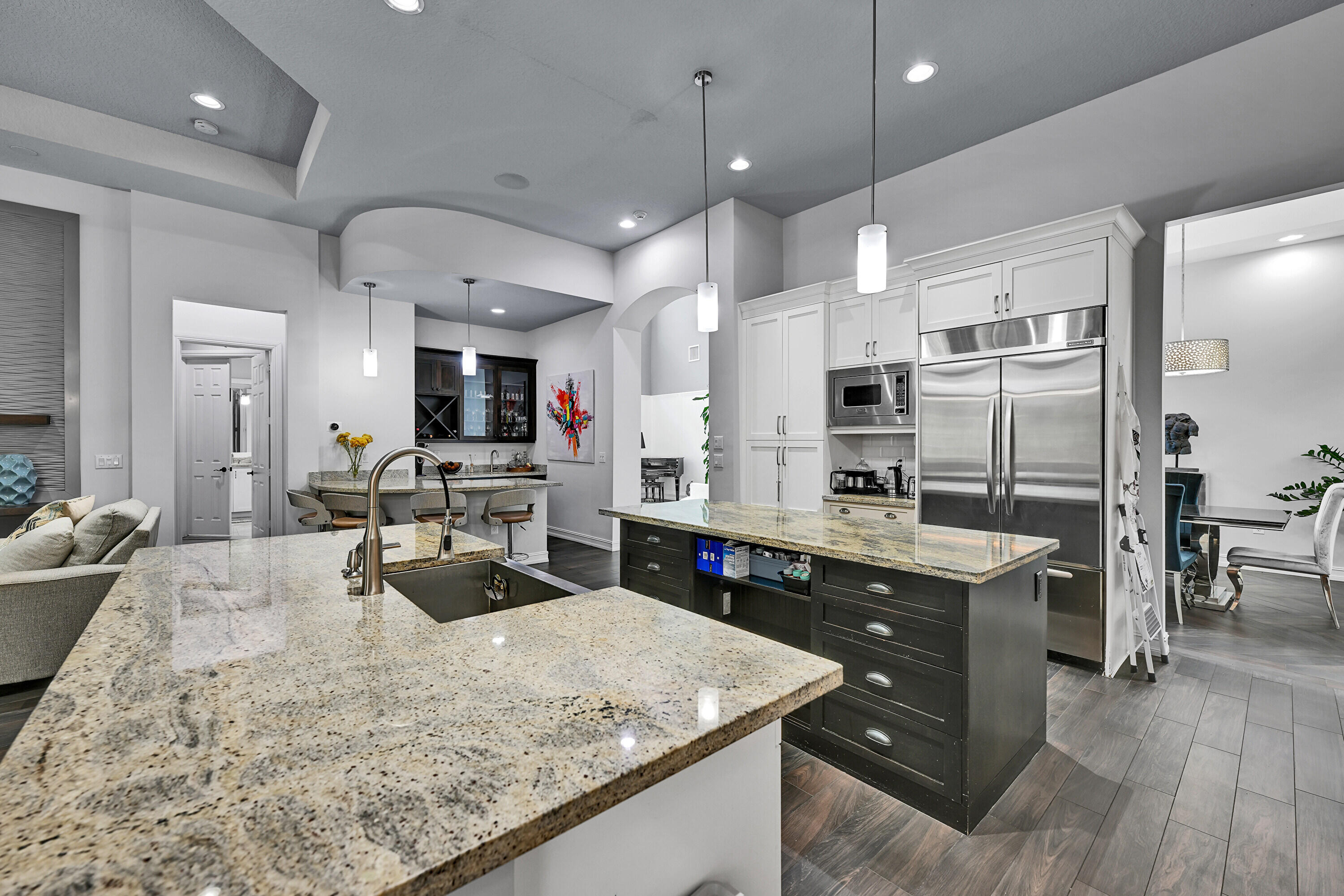 8652 Lewis River Road Delray Beach, FL 33446 - Photo 32 of 85 a kitchen with stainless steel appliances granite countertop a sink stove and refrigerator
