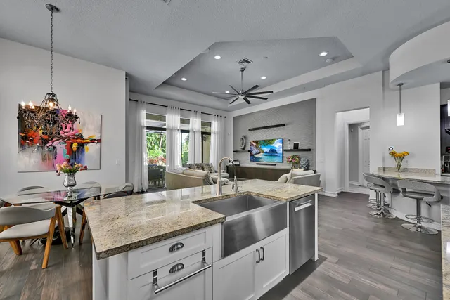 a view of a potted flower in front of a glass door