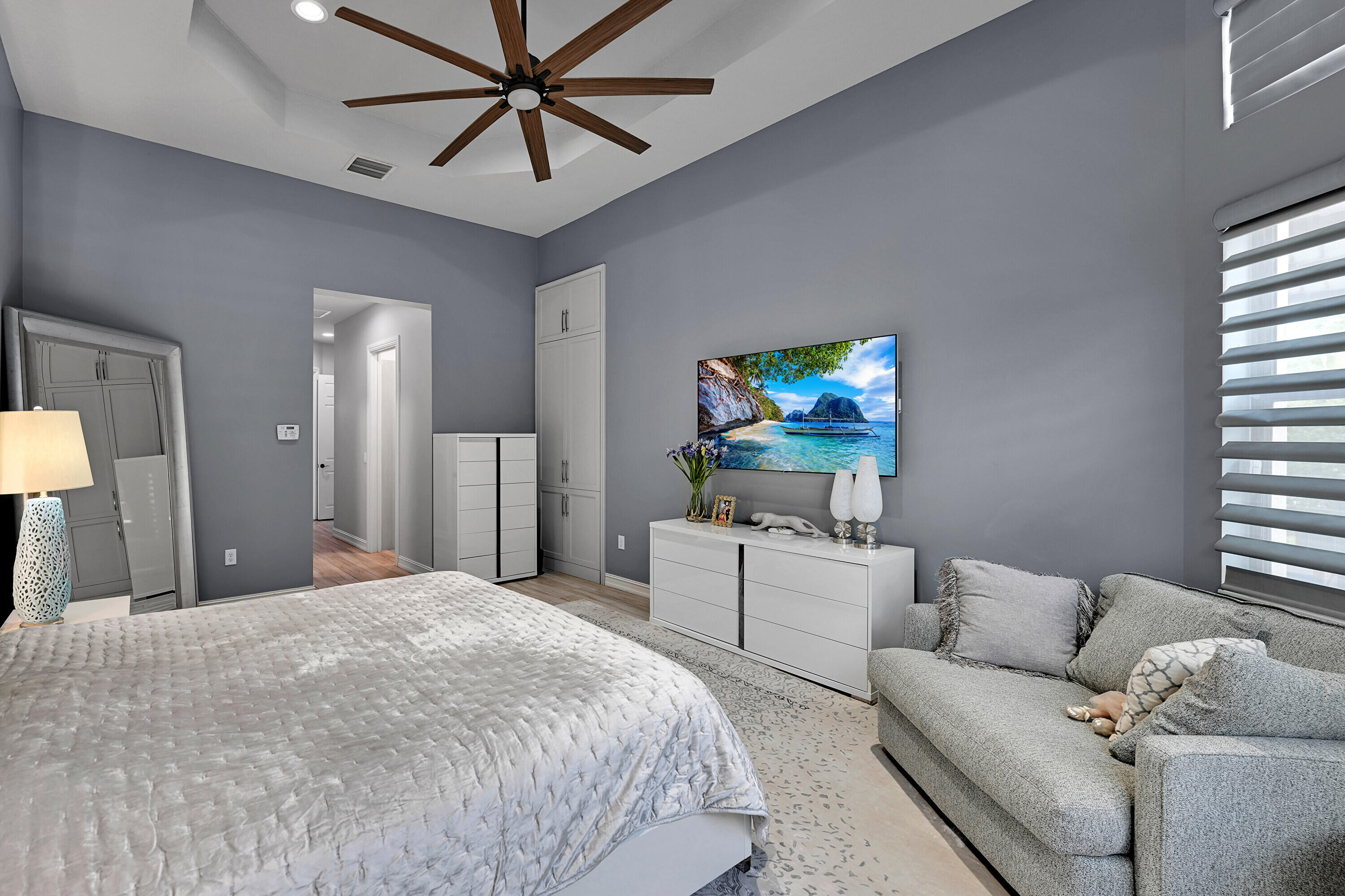 8652 Lewis River Road Delray Beach, FL 33446 - Photo 44 of 85 a bedroom with a bed couch and window