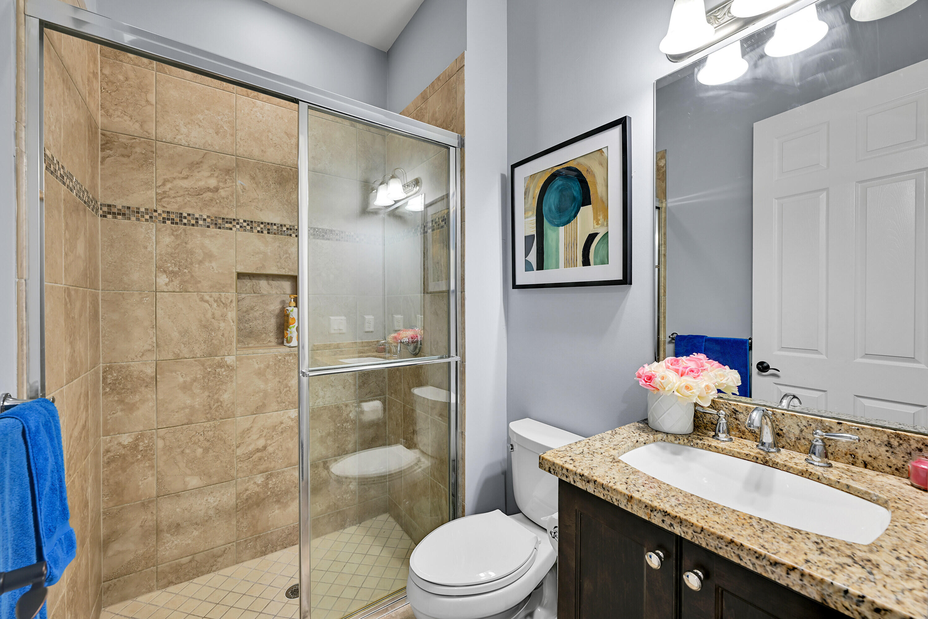 8652 Lewis River Road Delray Beach, FL 33446 - Photo 46 of 85 a bathroom with a granite countertop sink a toilet and shower