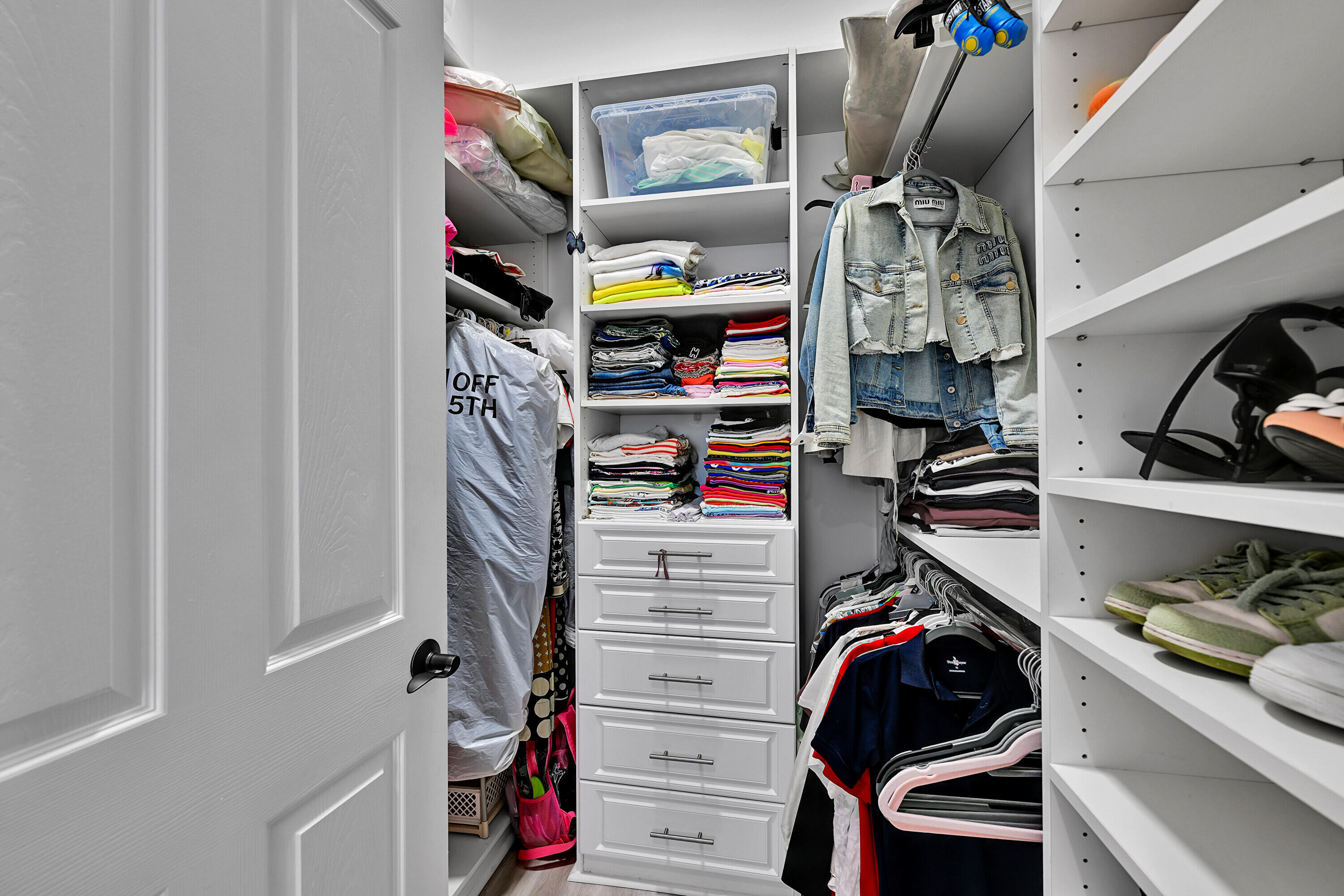 8652 Lewis River Road Delray Beach, FL 33446 - Photo 54 of 85 a view of walk in closet with clothes and shoes