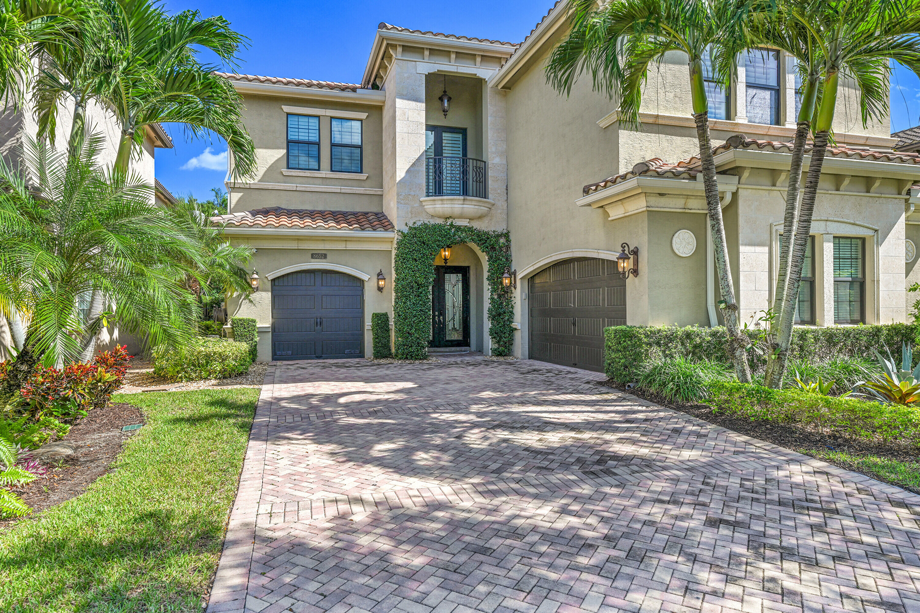 8652 Lewis River Road Delray Beach, FL 33446 - Photo 6 of 85 a front view of a house with garden