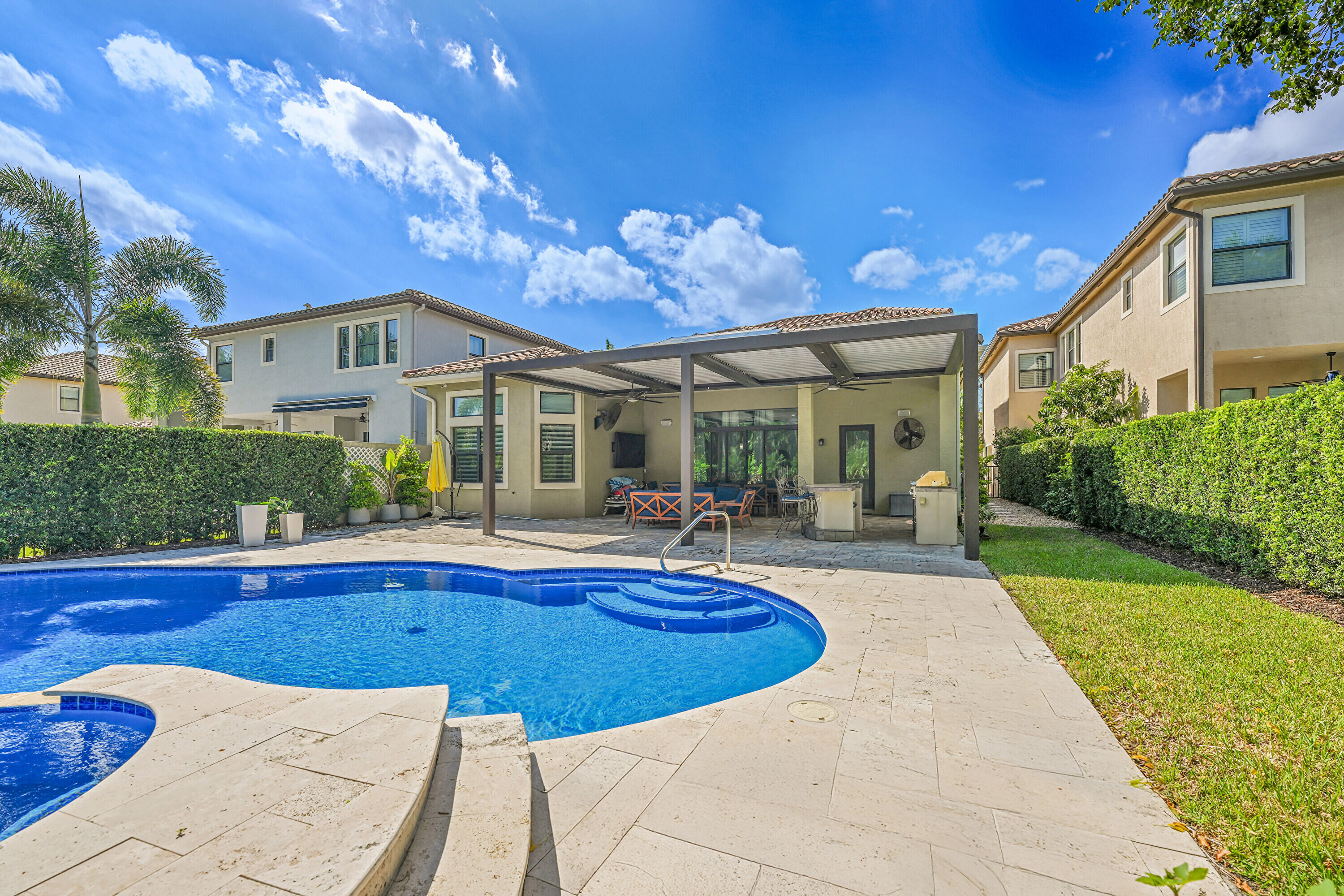 8652 Lewis River Road Delray Beach, FL 33446 - Photo 67 of 85 a view of a house with swimming pool yard and patio