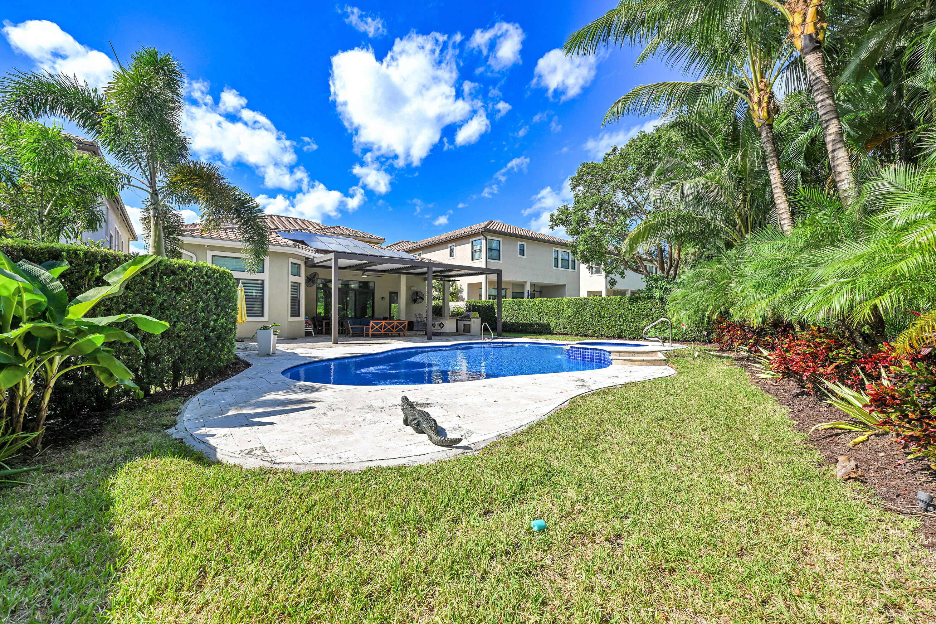8652 Lewis River Road Delray Beach, FL 33446 - Photo 70 of 85 a view of yard with swimming pool and green space