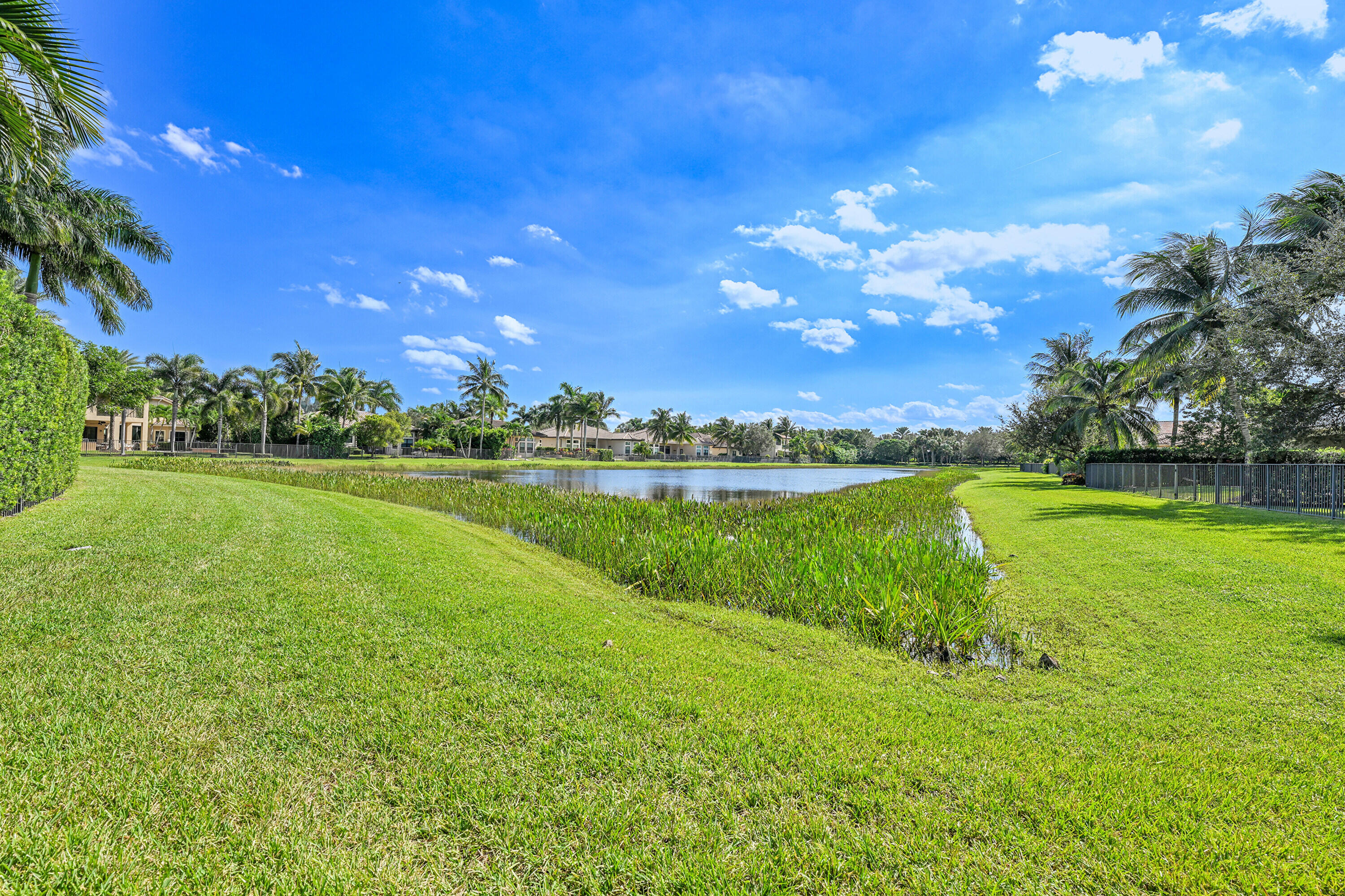 8652 Lewis River Road Delray Beach, FL 33446 - Photo 71 of 85 a view of a golf course with a lake