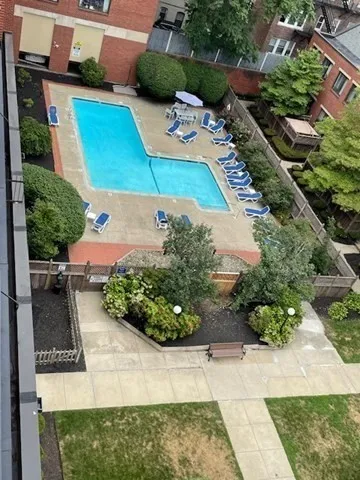 an aerial view of a house with yard